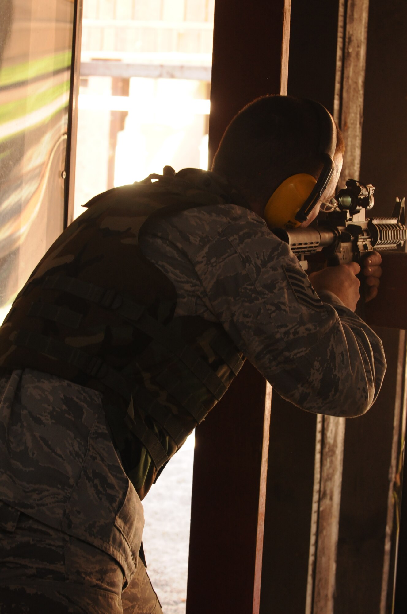 An Airman fires an M-4 assault rifle Sept. 13 at the Aviano Air Base, Italy, firing range. To qualify, Airmen must complete combat arms training and successfully hit 25 out of 50 targets.  (U.S. Air Force photo/Airman 1st Class Jenay Randolph)