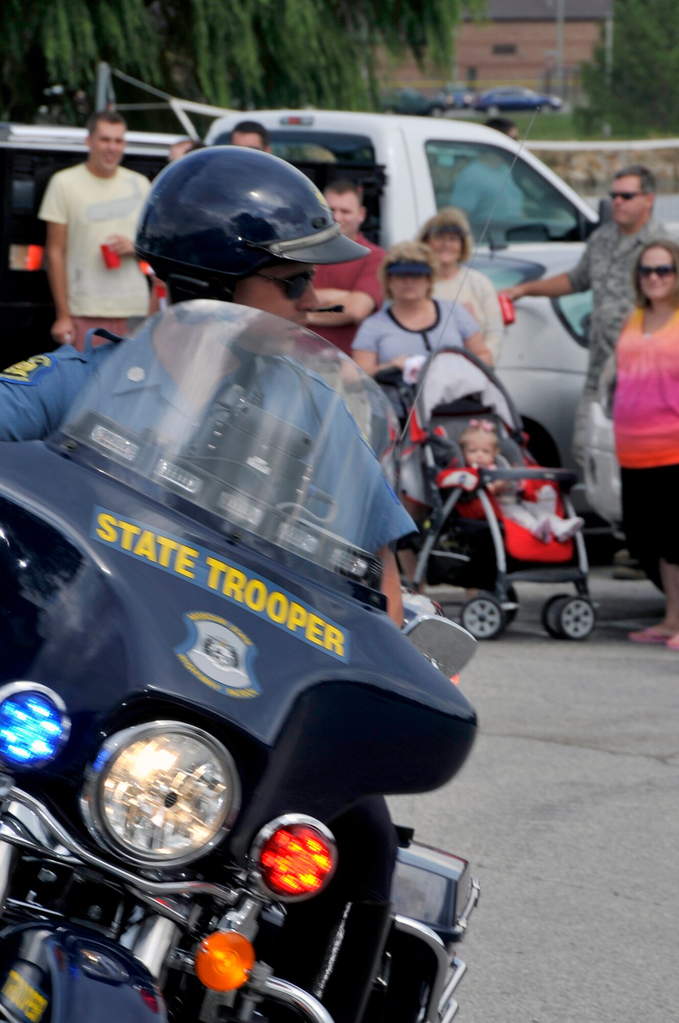 A Missouri State Highway patrolman performs a motorcycle demonstration for reservists and their families during the 442nd Fighter Wing family day picnic, Sept. 10, 2011. The 442nd FW is an A-10 Thunderbolt II Air Force Reserve unit at Whiteman AIr Force Base, Mo. (U.S. Air Force photo/ Senior Airman Wesley Wright)