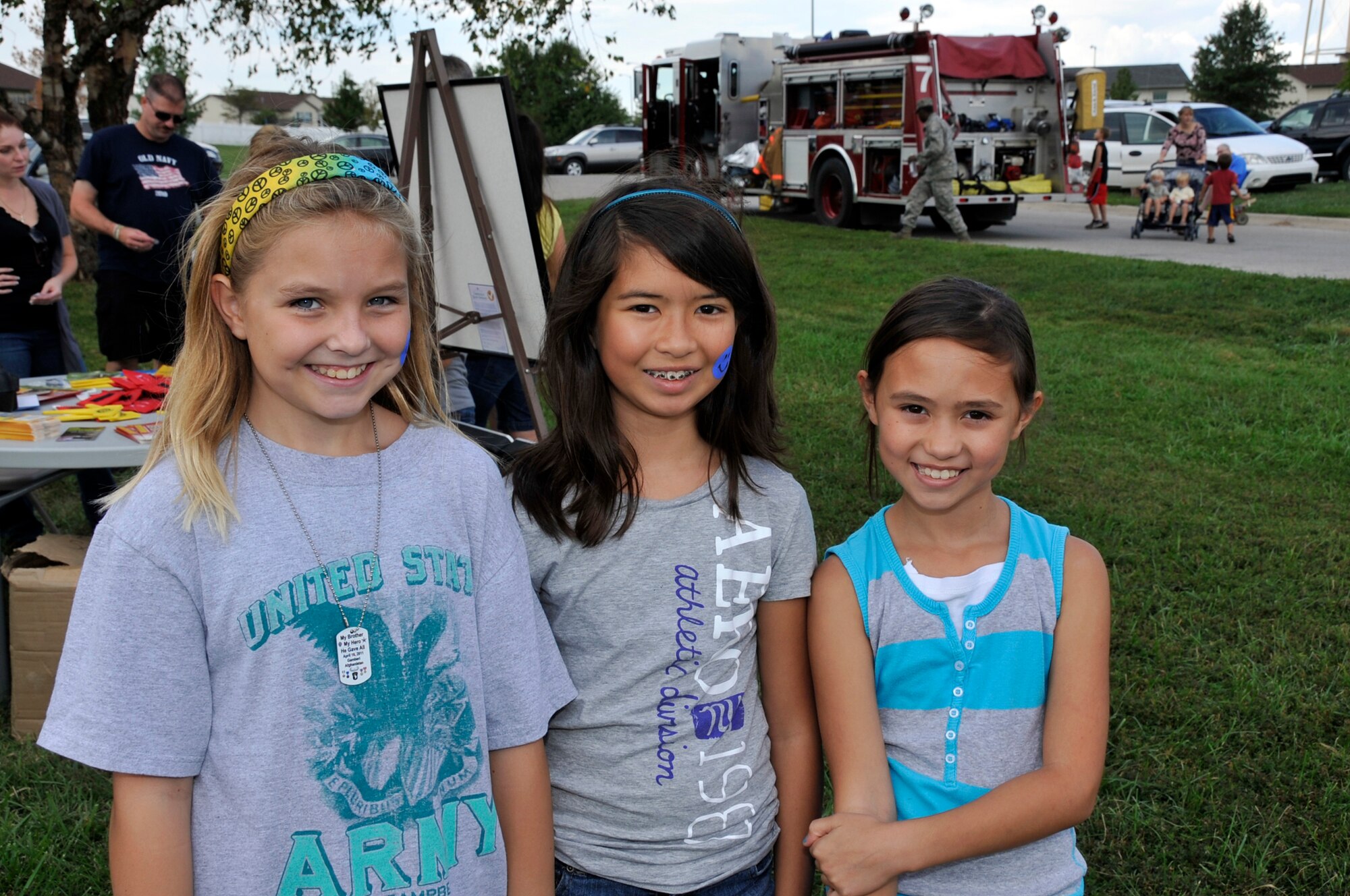 Children enjoy activities such as the bounce house and face painting during the 442nd Fighter Wing Family Day picnic, Sept. 10, 2011. The 442nd FW is an A-10 Thunderbolt II Air Force Reserve unit at Whiteman AIr Force Base, Mo. (U.S. Air Force photo/ Senior Airman Wesley Wright)
