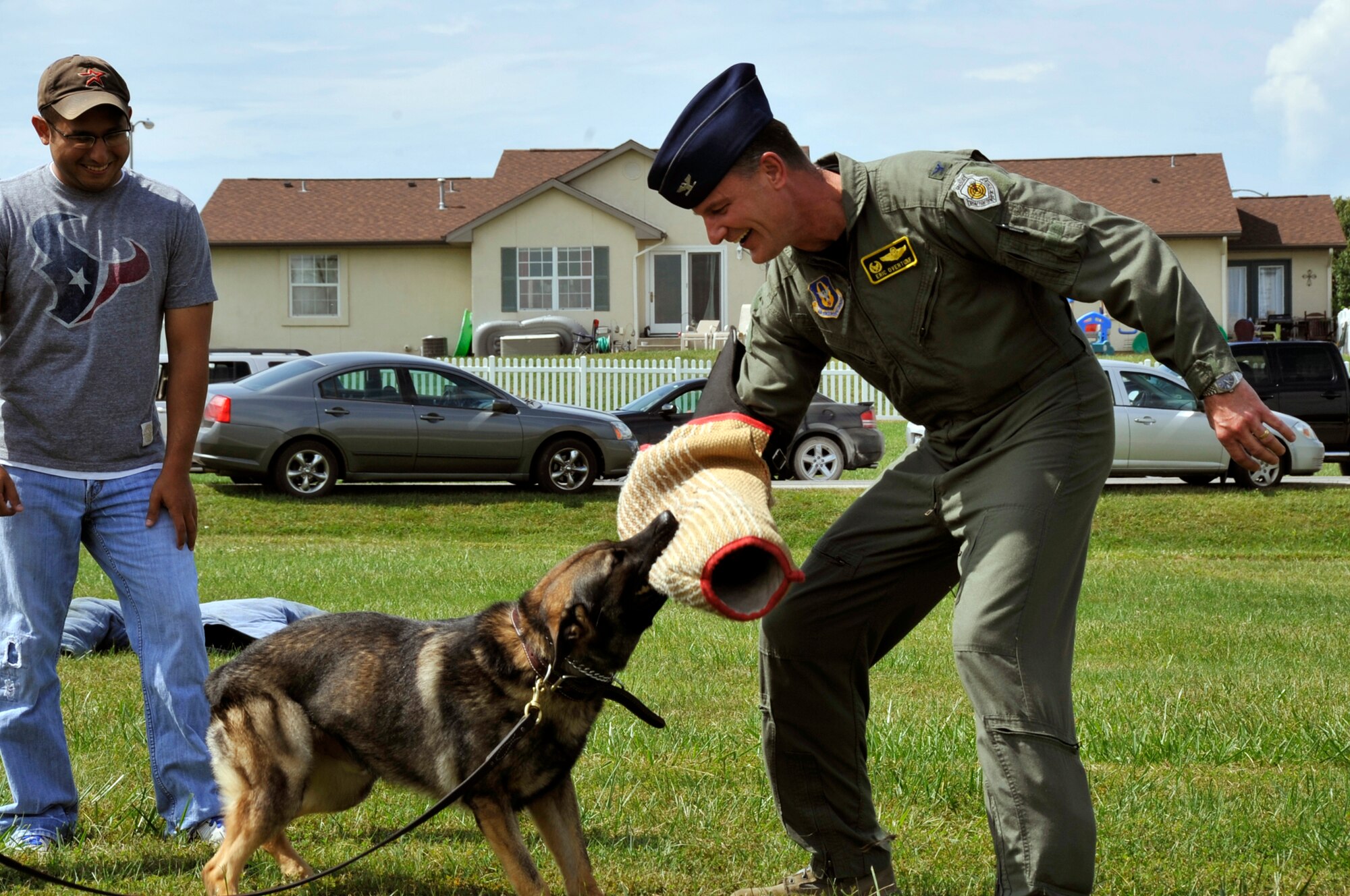 Col. Eric Overturf, 442nd FIghter Wing commander, participates in a police working dog demonstration, Sept. 10, 2011 at the wing family day picnic.The 442nd FW is an A-10 Thunderbolt II Air Force Reserve unit at Whiteman AIr Force Base, Mo. (U.S. Air Force photo/ Senior Airman Wesley Wright)