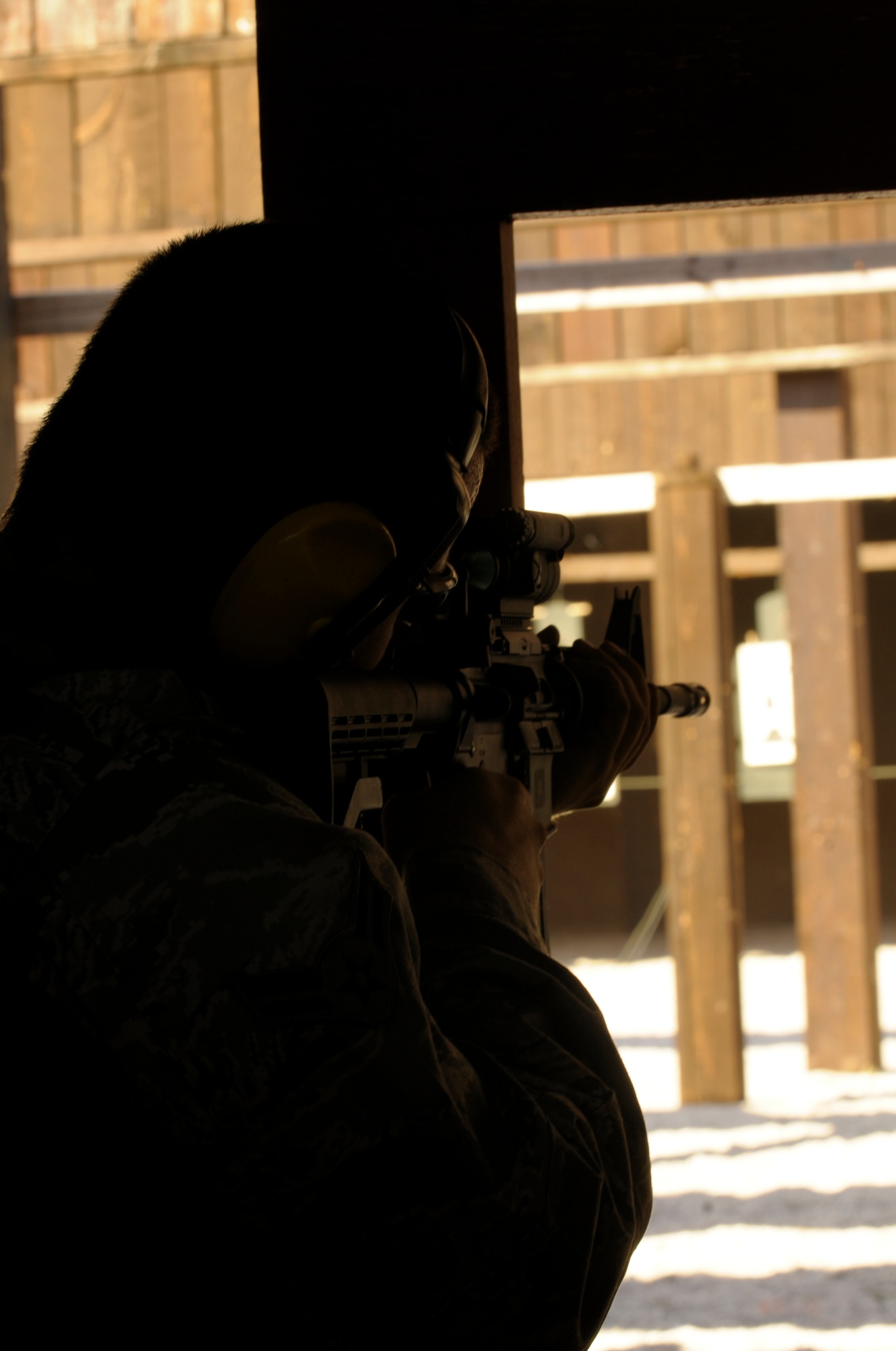 An Airman fires an M-4 assault rifle Sept. 13 at the Aviano Air Base, Italy, firing range. To qualify, Airmen must complete combat arms training and successfully hit 25 out of 50 targets. (U.S. Air Force photo/Airman 1st Class Briana Jones)