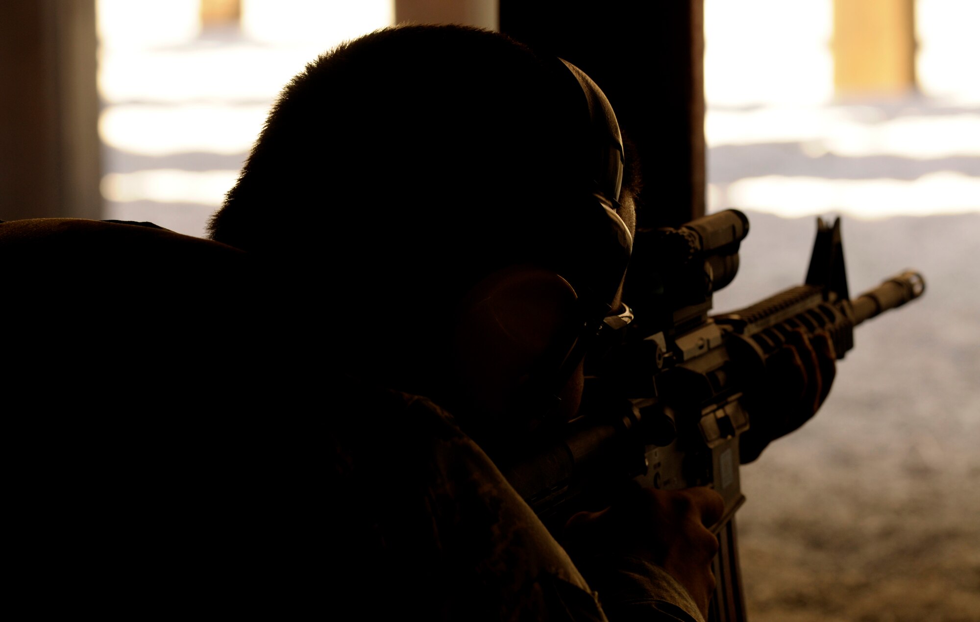 An Airman fires an M-4 assault rifle Sept. 13 at the Aviano Air Base, Italy, firing range. To qualify, Airmen must complete the combat arms training and successfully hit 25 out of 50 targets. (U.S. Air Force photo/Airman 1st Class Briana Jones)