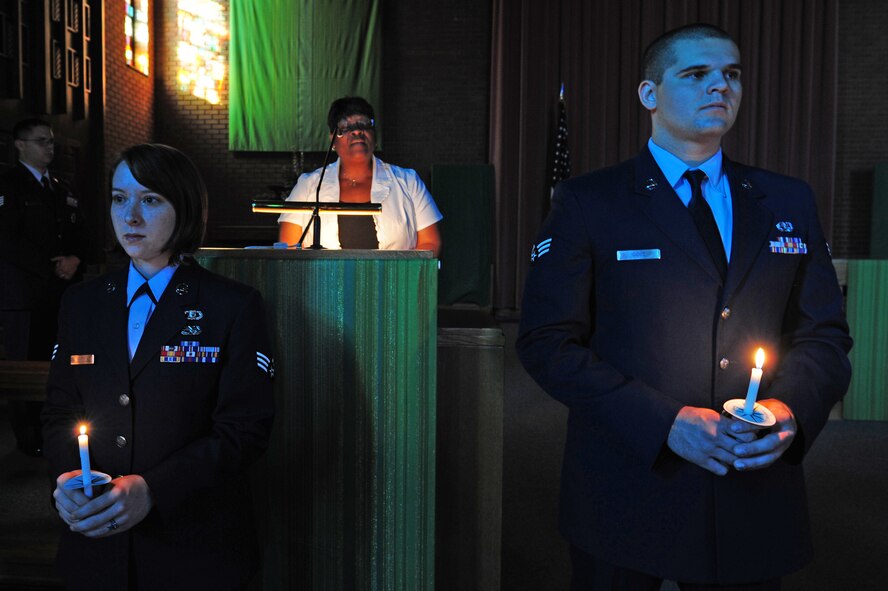 Airmen from the Airman Leadership School hold a candle light vigil in remembrance of the prisoners of war and missing in action at the chapel on Seymour Johnson Air Force Base, N.C., Sept. 14, 2011. Many activities will take place on base leading up to the POW/MIA ceremony Sept. 16. (U.S. Air Force photo by Senior Airman Rae Perry)
