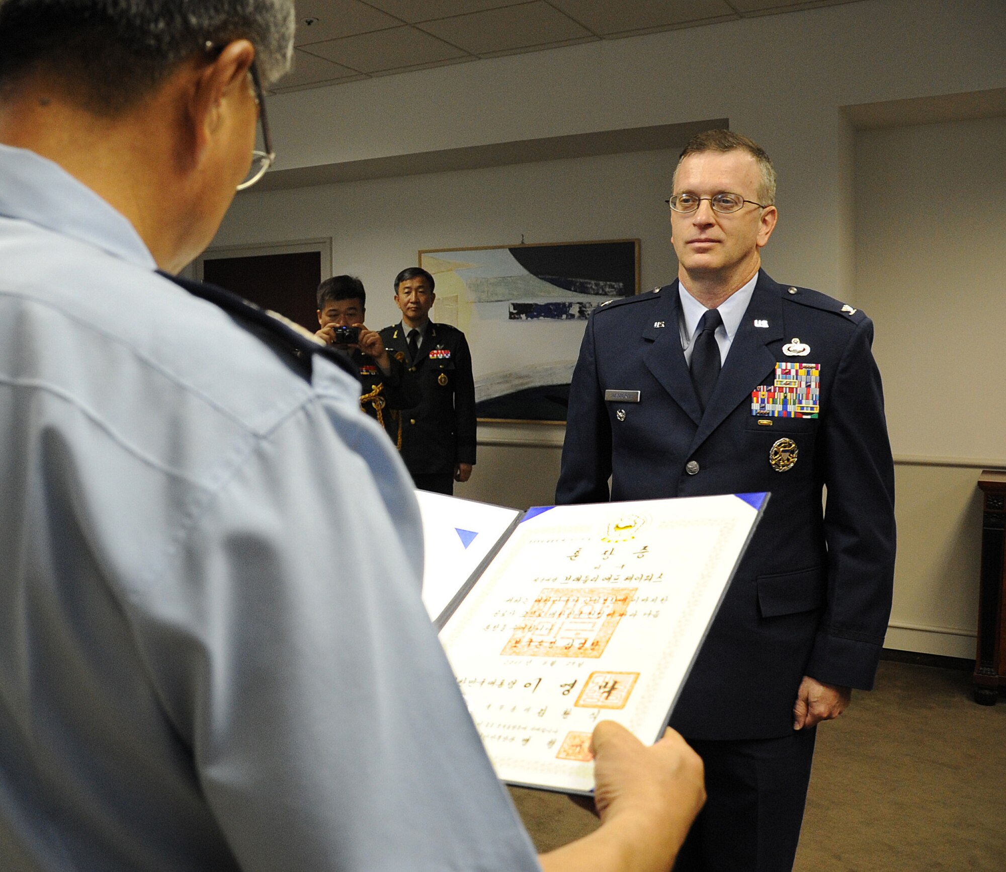 WASHINGTON, D.C. -- Col. Bradley Hayworth, directof of intelligence, surveillance and reconnaisance at Air Force Global Strike Command, is presented the Order of National Security Merit, also known as the Samil Medal, by Lt. Gen. Yoon Hak Soo, director of Korea Defense Intelligence Agency, at the Embassy of the Republic of Korea here Sept. 13, 2011. (U.S. Air Force photo/Staff Sgt. Tiffany Trojca)