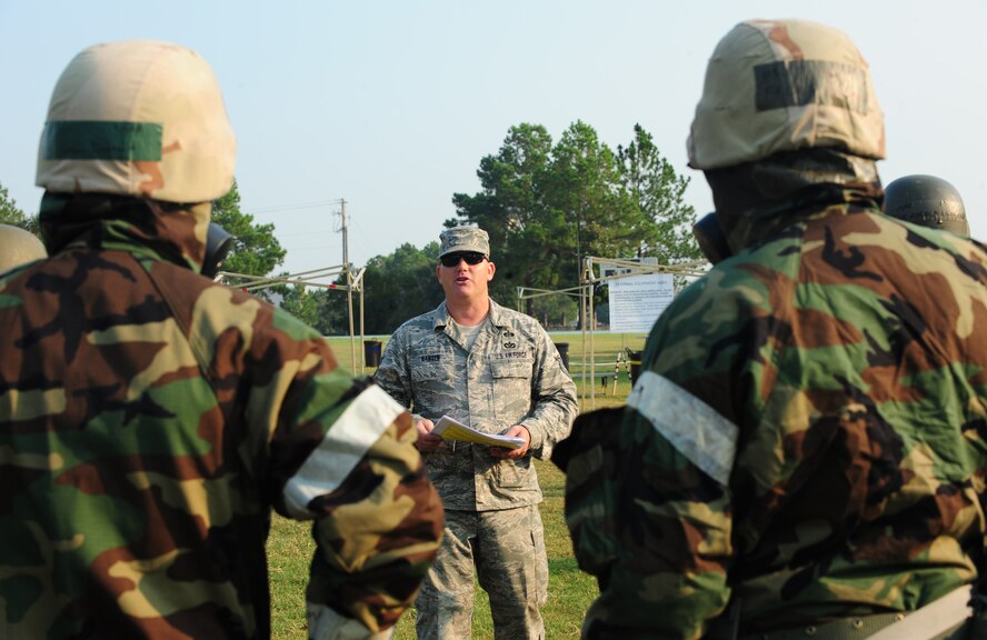 U.S. Air Force Tech. Sgt. Mark Hansen, 23rd Civil Engineer Squadron readiness and emergency management, briefs the Airmen before entering the contamination control area (CCA) during a decontamination process training at Moody Air Force Base, Ga., Sept. 14, 2011. The CCA allows Airmen exposed to hazards from biological to chemical agents to become uncontaminated in a controlled environment. (U.S. Air Force photo by Senior Airman Stephanie Mancha/Released)