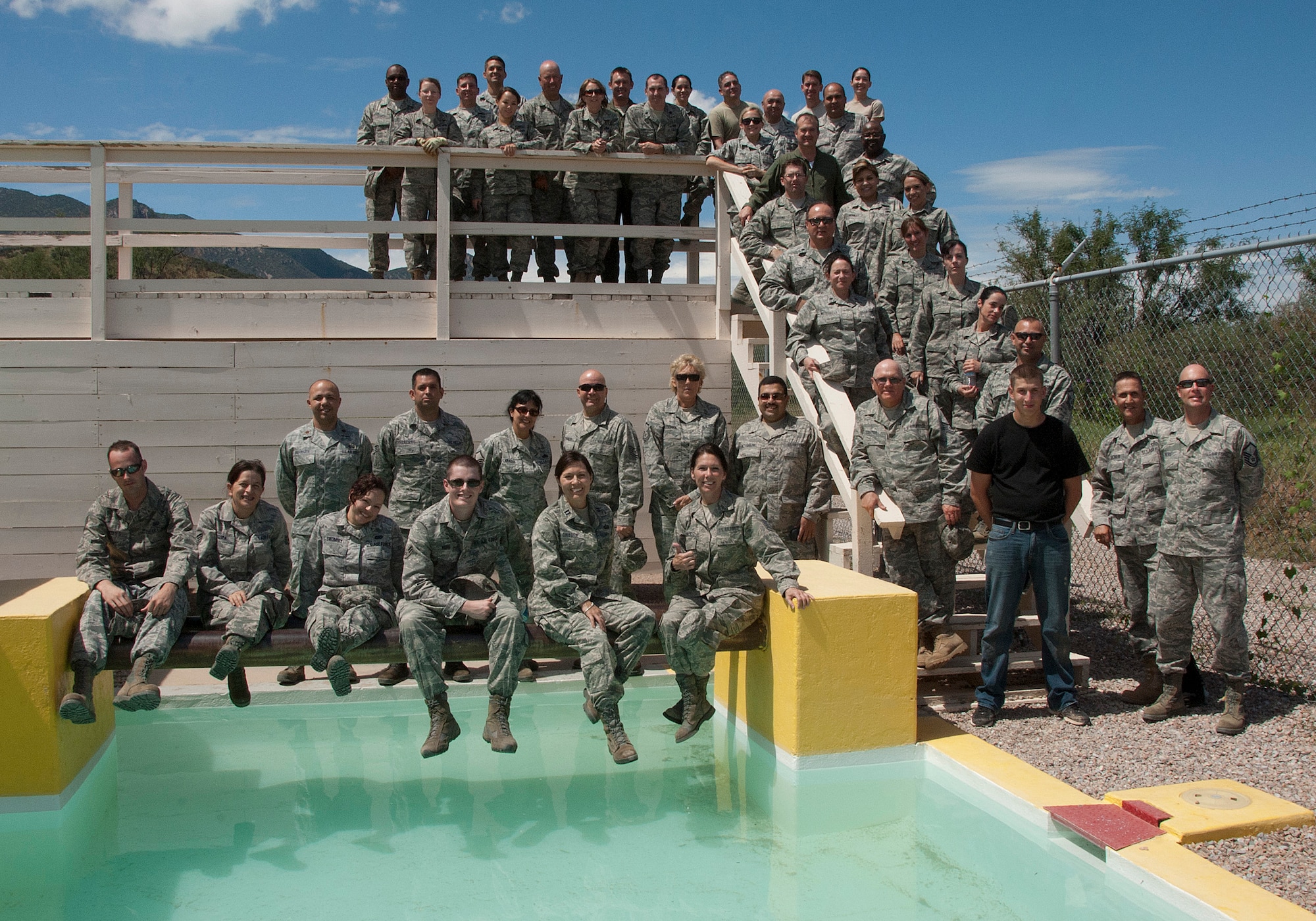 Reaction Course participants and team monitors from the 162nd Fighter Wing Headquarters Squadron complete a successful day posing for a group photo..  (U.S. Air Force photo/Staff Sgt. Mike Whitt)