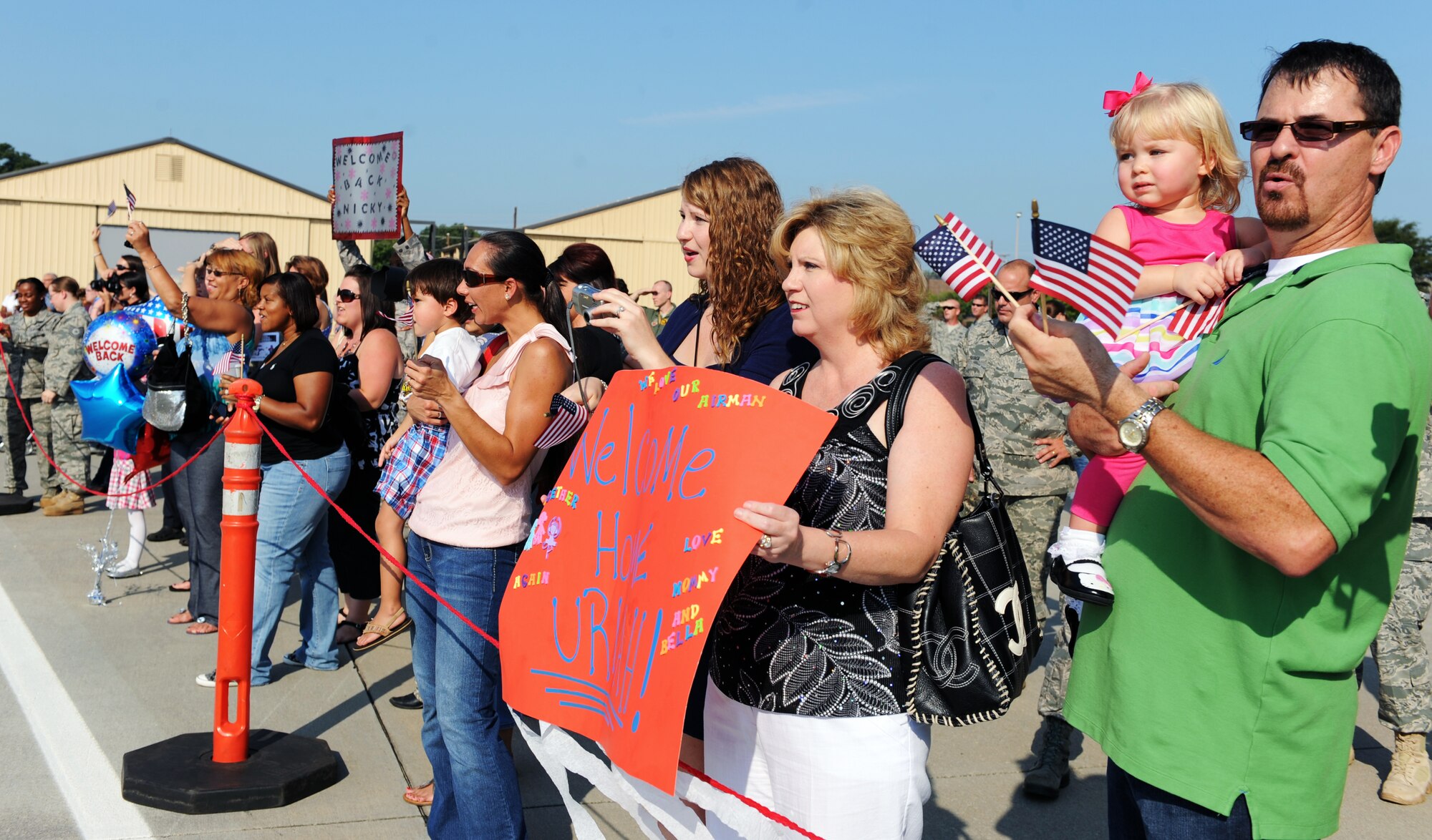 Families welcome their loved ones home to Shaw Air Force Base, S.C. Sept. 14, 2011. The 77th Fighter Squadron returned from a five month deployment after providing air suppression and destruction of enemy defenses in support of Operation Unified Protector. (U.S. Air Force photo by Airman 1st Class Tabatha Duarte/Released)