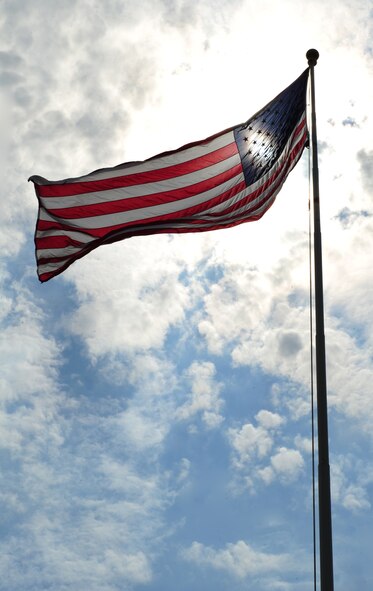 An American Flag waves in the wind in front of the 2nd Bomb Wing headquarters on Barksdale Air Force Base, La., Sept. 14. The current American Flag design has not been changed for more than 50 years. (U.S. Air Force photo/Airman 1st Class Benjamin Gonsier)(RELEASED)
