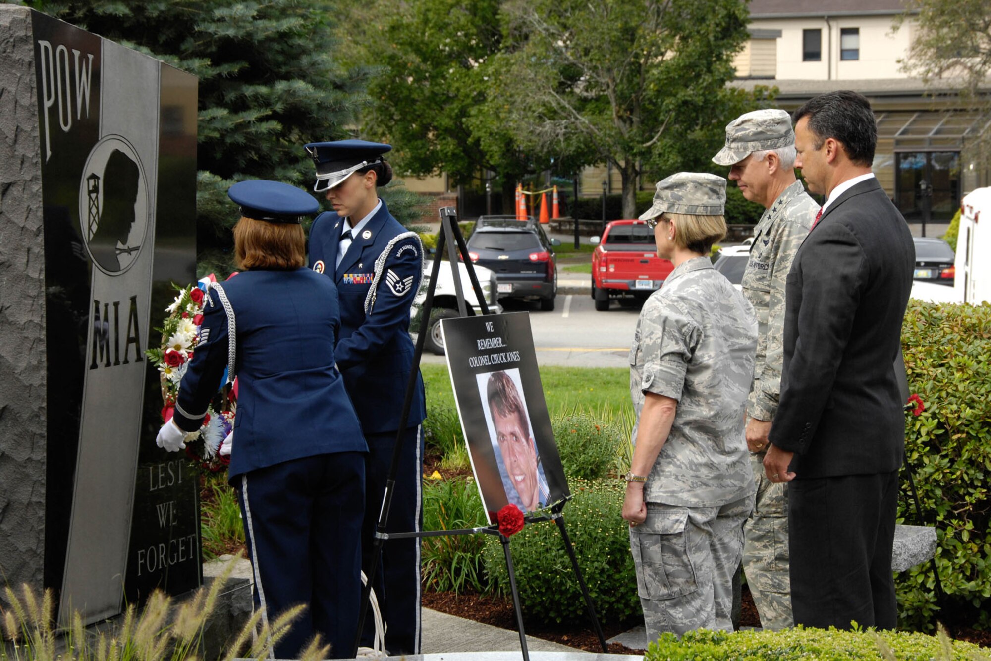 HANSCOM AIR FORCE BASE, Mass. – Jonathan Elias (right), WBZ-TV news anchor, 66th Air Base Group honorary commander and speaker for Hanscom’s Sept. 11 ceremony, watches along with Lt. Gen. Charles (C.R.) Davis, Electronic Systems Center commander, and Col. Stacy L. Yike, 66th Air Base Group commander, as Patriot Honor Guard members lay a wreath to honor the victims of the Sept. 11 attacks at the POW/MIA memorial. The ceremony also honored the memory of Col. Chuck Jones and Brian Sweeney, two former Hanscom teammates who perished during the Sept. 11 attacks. After the ceremony, attendees took a photo remembrance walk to the Minuteman Commons, where they could watch a video of base personnel answering the question, “Where were you and how did it change your world?” (U.S. Air Force photo by Linda LaBonte Britt)