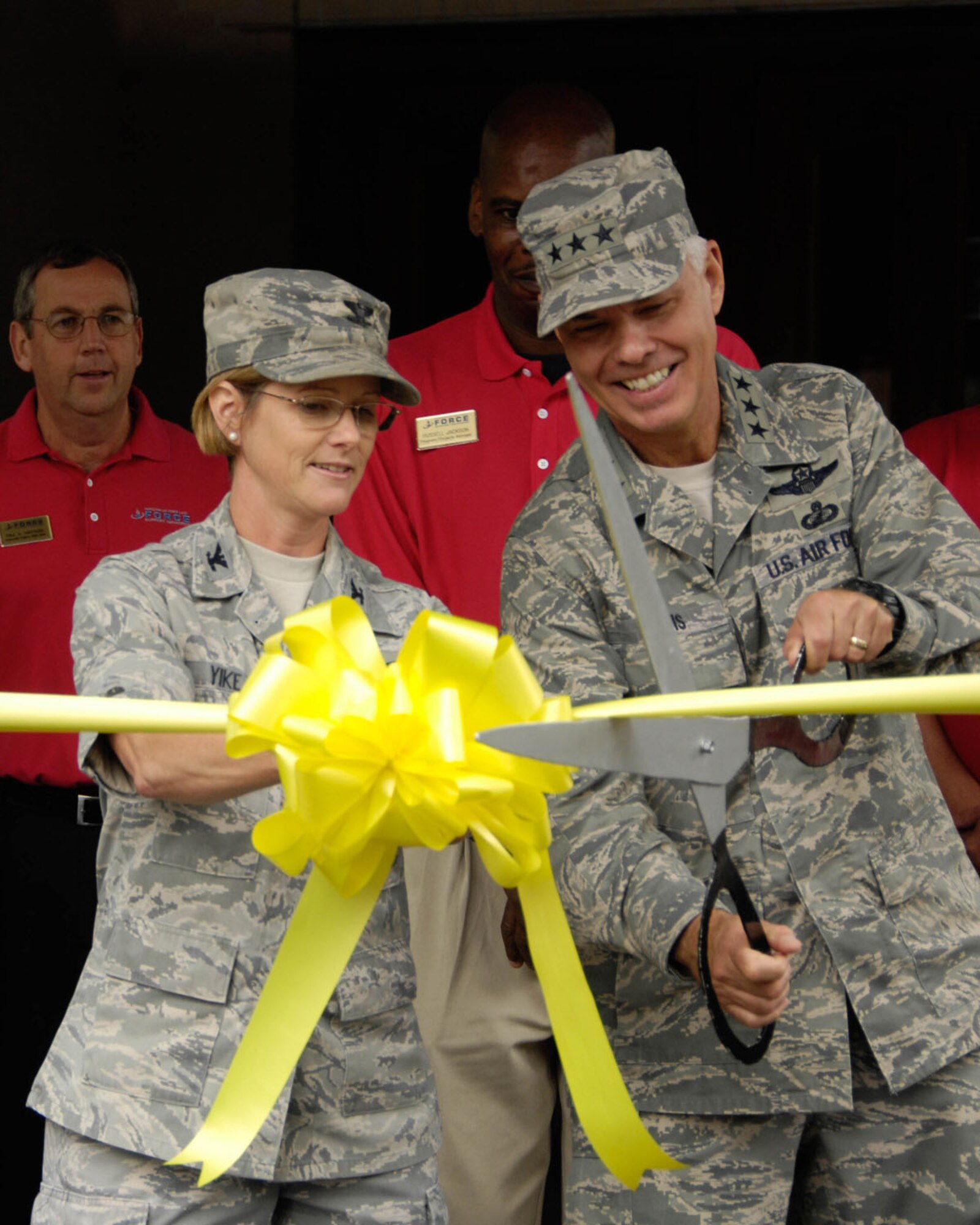 HANSCOM AIR FORCE BASE, Mass. – Lt. Gen. Charles (C.R.) Davis (right), Electronic Systems Center commander, and Col. Stacy L. Yike, 66th Air Base Group commander, cut the ribbon to signify the grand opening of the Minuteman Commons Sept. 8. The Hanscom community was invited to the grand opening to learn about all the offerings of this new community center. (U.S. Air Force photo by Linda LaBonte Britt)