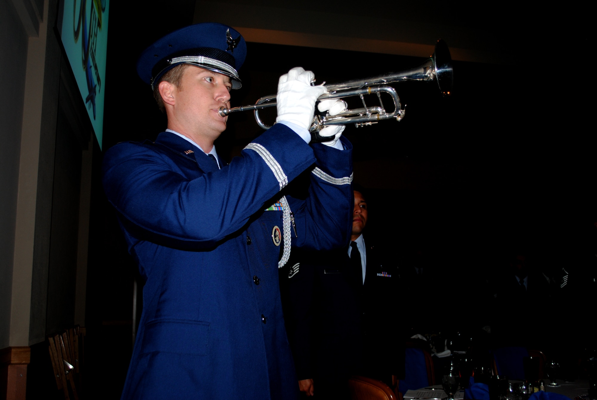 Capt. Stephen Brint Carlton, 433rd Airlift Wing Honor Guard trumpeter, plays, "Amazing grace," while guests stand respectfully in silence during a POW/MIA table ceremony. The solemn ceremony for the and service members categorized as prisoners of war and missing in action was part of a series of activities  conducted during the 433rd Airlift Wing 60th Anniversary Dinner held Sept. 10, 2011, at the Gateway Club on Lackland Air Force Base, Texas.   (U.S. Air Force photo/Senior Airman Luis Loza Gutierrez)