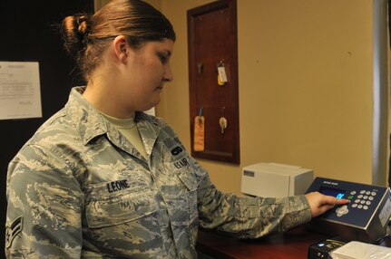 Airman 1st Class Veronica Leone resets the new personally procured move scale system, Sept. 13, 2011, on Joint Base Charleston-Air Base. The scale system is used by service members who have been ordered a permanent change of station, or PCS, and have decided to move their personal belongings themselves via truck. Leone is a package and crate specialist from the Traffic Management Flight. (U.S. Air Force photo/Airman 1st Class Jared Trimarchi)

