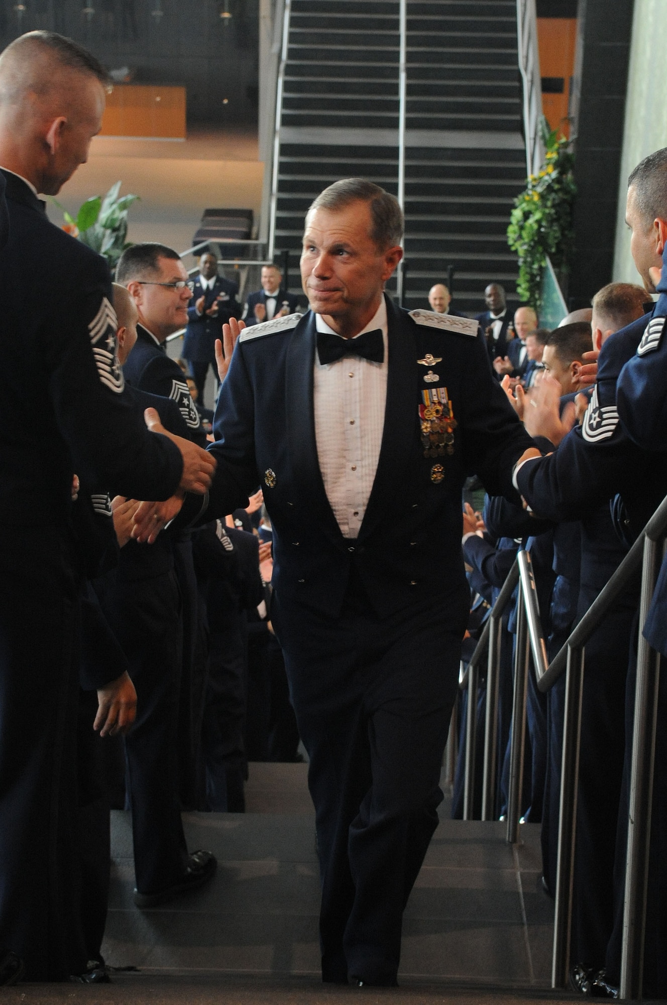 U.S. Air Force Gen. William Fraser III, commander of Air Combat Command, greets Airmen at the ACC Order of the Sword ceremony in Hampton, Va., Sept. 12, 2011. Fraser served as the commander of ACC, which operates more than 1,000 aircraft, 22 wings, 13 bases, and more than 300 operating locations worldwide with 79,000 active-duty and civilian personnel. U.S. Air Force photo by Airman 1st Class Racheal Watson/Released)
