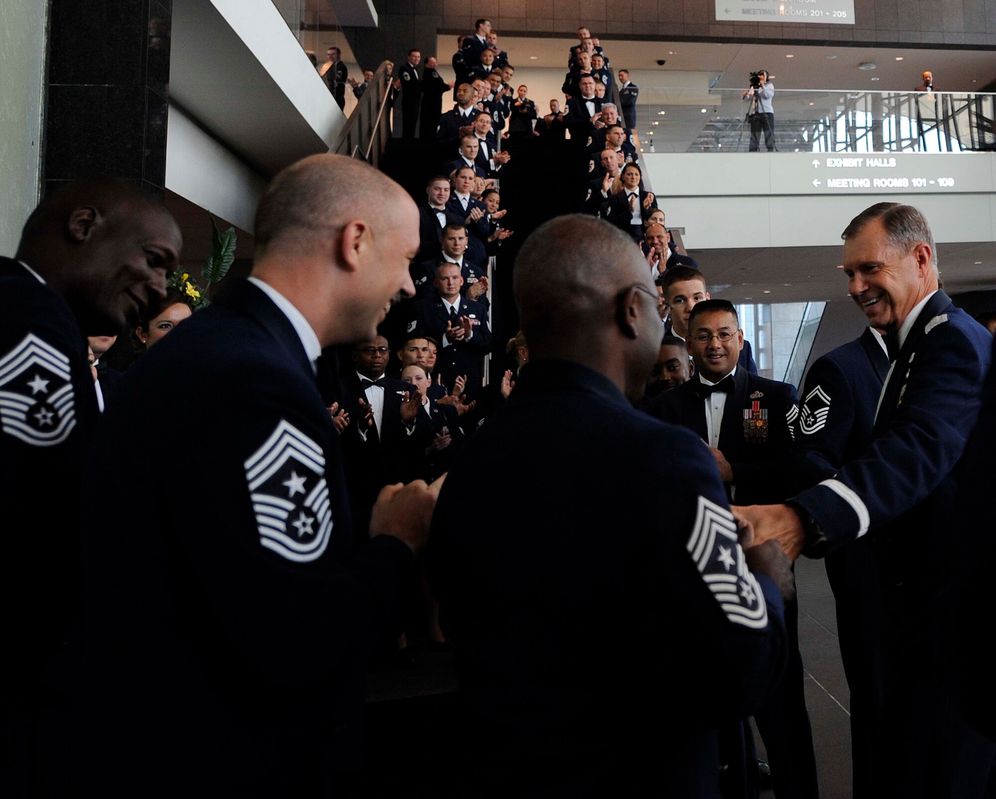 U.S. Air Force Gen. William M. Fraser III commander of Air Combat Command greets command chiefs from ACC bases during the Order of the Sword Ceremony Sept. 12, 2011, in Hampton, Va. Fraser was recognized by the command?s enlisted Airmen for his superior leadership and dedication to the command. (U.S. Air Force photo by Staff Sgt. Dana Hill/Released)