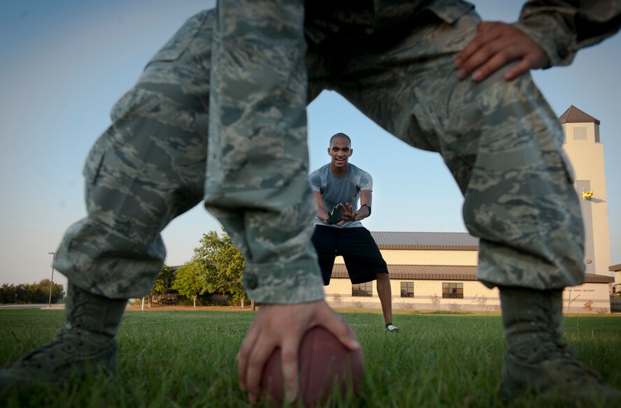 Mark Lawson, 23rd Wing Staff intramural team quarterback, hikes a football during team practice at Moody Air Force Base, Ga., Sept. 13, 2011. The flag football season kicks off the first week of October but teams around base have started practicing to get a feel for their team’s weaknesses and strengths. (U.S. Air Force photo by Airman 1st Class Joshua Green/Released)
