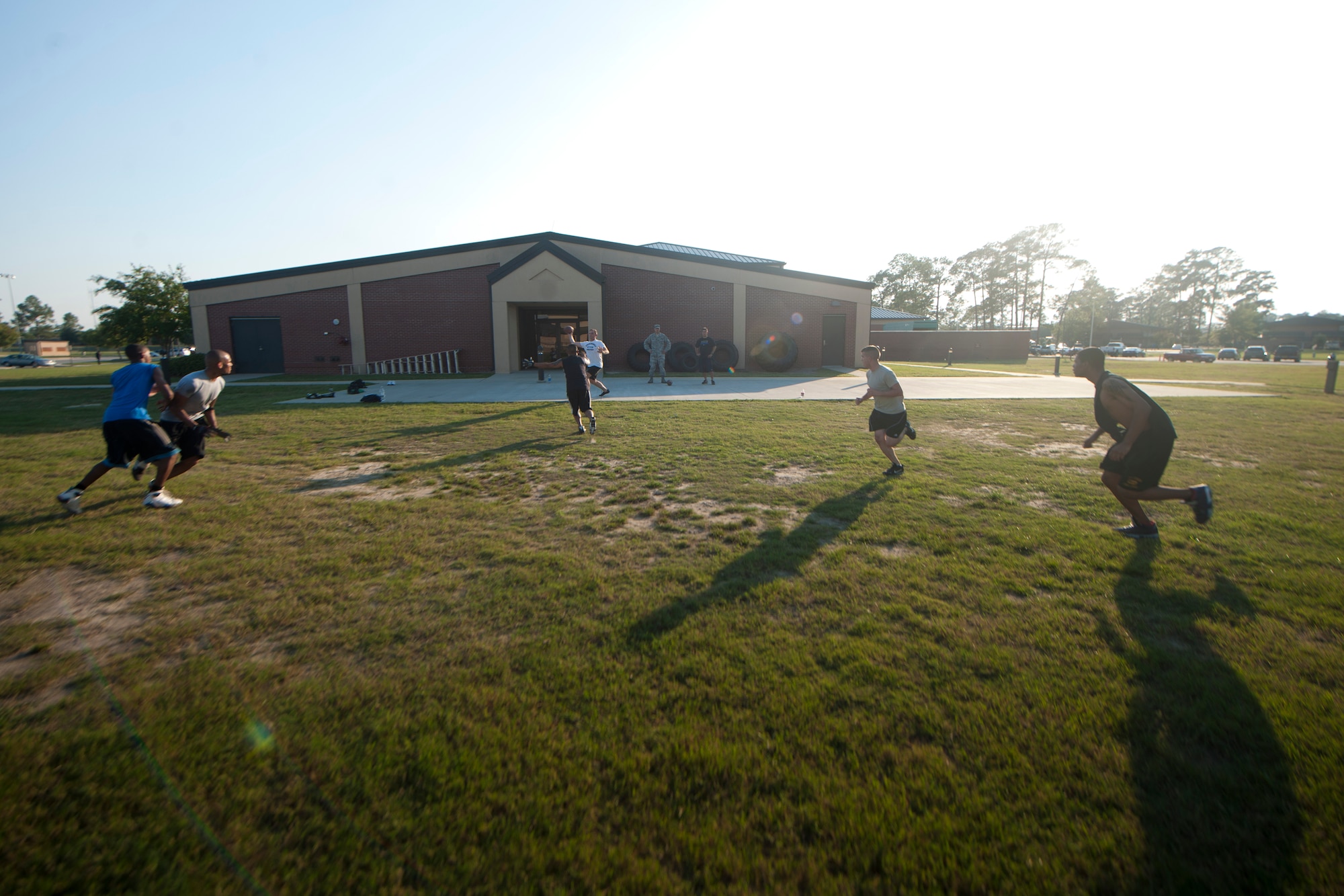 The 23rd Wing Staff intramural foot team runs three-on-three drills during practice at Moody Air Force Base, Ga., Sept. 13, 2011. Other squadrons around base have started practicing as well for the start of the flag football season, the first week of October. (U.S. Air Force photo by Airman 1st Class Joshua Green/Released)
