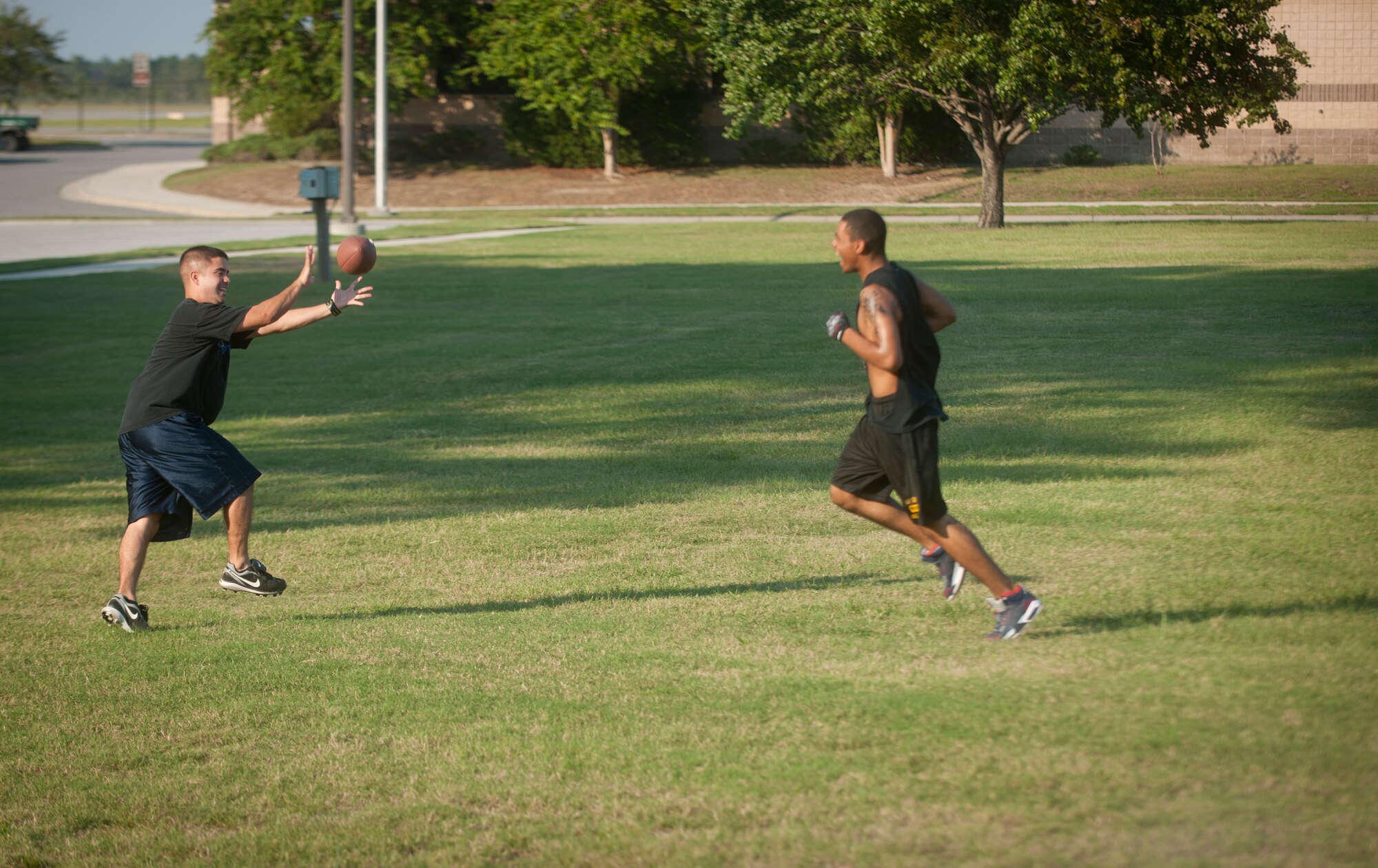 Thomas Hutchins, a 23rd Wing Staff intramural football team wide receiver, catches the ball after he juked a defender during a practice at Moody Air Force Base, Ga., Sept. 13, 2011. The basic rules of flag football are similar to those of the mainstream game but instead of tackling players, the defensive team must remove a flag to end the play. (U.S. Air Force photo by Airman 1st Class Joshua Green/Released)
