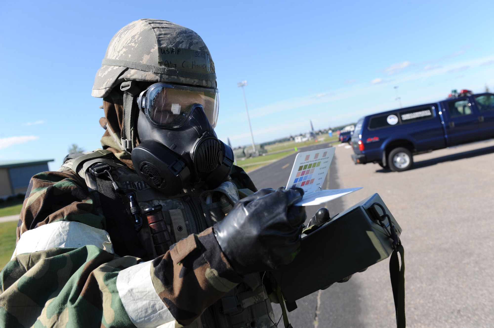Staff Sgt. Alex Hooper, 19th Civil Engineer Squadron emergency management, uses an M256 Kit to identify a simulated chemical type that was used during a chemical attack Sept. 13, 2011, at Volk Field, Wis. The operational readiness exercise tested the 19th Airlift Wing's ability to deploy quickly and operate in a chemical combat environment in preparation for an operational readiness inspection in October. (U.S. Air Force photo by Tech. Sgt. Chad Chisholm)