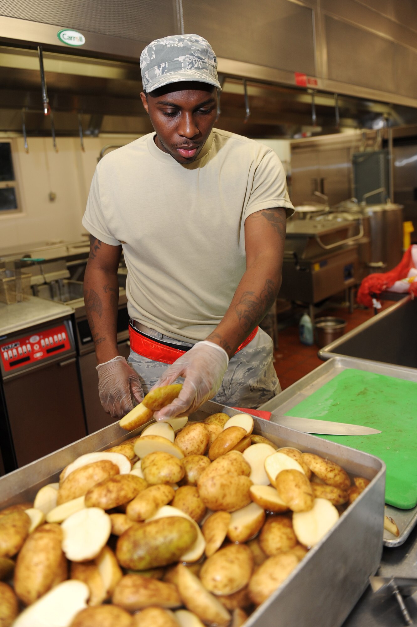 Staff Sgt. Sterling Jackson, a 19th Force Support Squadron food service specialist, prepares potatoes for the evening dinner Sept. 14, 2011 at Volk Field, Wis. The 19th food service dining facility is used to feed Airmen breakfast and dinner during the operational readiness exercise. 