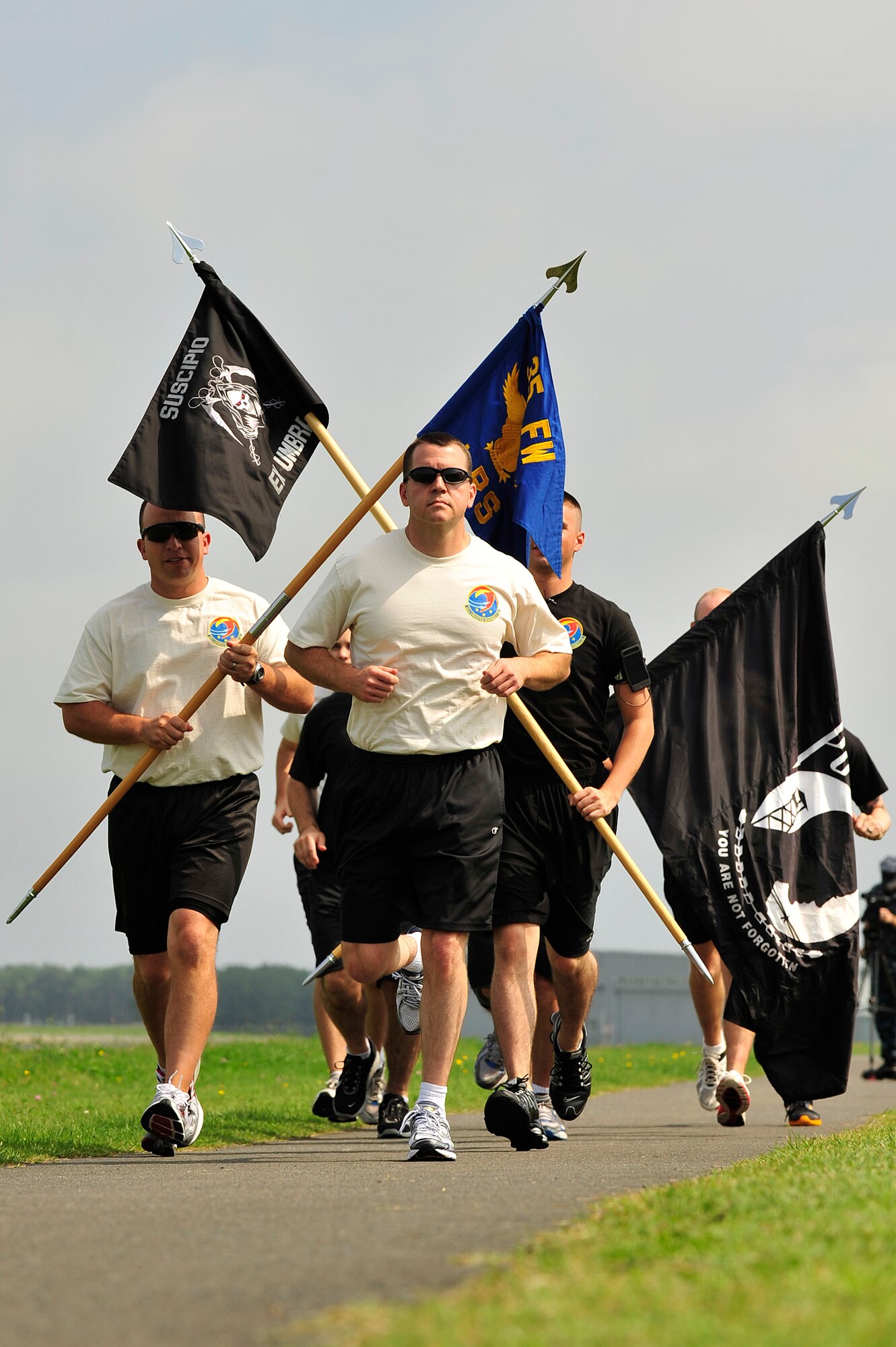 MISAWA AIR BASE, Japan - Members of the 35th Logistics Readiness Squadron honor the sacrifice of all Prisoners of War and those Missing in Action during the 35th LRS POW/MIA Run, Sept. 15.  Members of the squadron will run the perimeter of the base for 24 hours in remembrance of prior service members who have gone missing in combat and endured enemy prison camps as part of their sacrifice. (U.S. Air Force photo/Staff Sgt. Nathan Lipscomb)