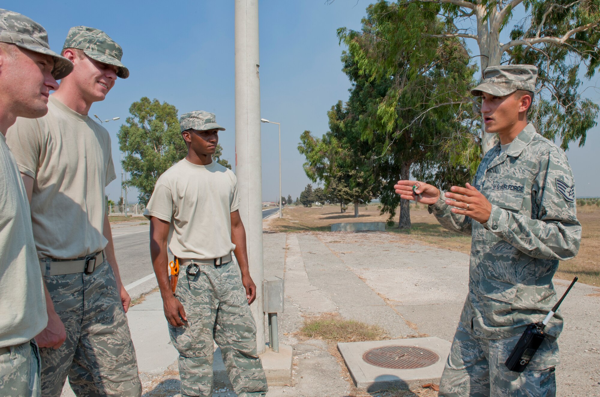 Staff Sgt. Robert Hernandez, 39th Communications Squadron cable and antenna system maintenance craftsman, right, discusses upcoming jobs to fix cables around base, Sept. 14, 2011, at Incirlik Air Base, Turkey. Cable maintenance Airmen have more than 600 miles of cable to check and maintain here. (U.S. Air Force photo by Senior Airman Anthony Sanchelli/Released)