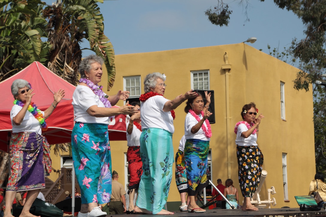 The Bayside Babes teach hula dancing to the crowd at the Multicultural Heritage Day event at the Command Museum aboard Marine Corps Recruit Depot San Diego Sept. 15. The four-hour event featured 22 different cultures from around the world with performances and information booths.