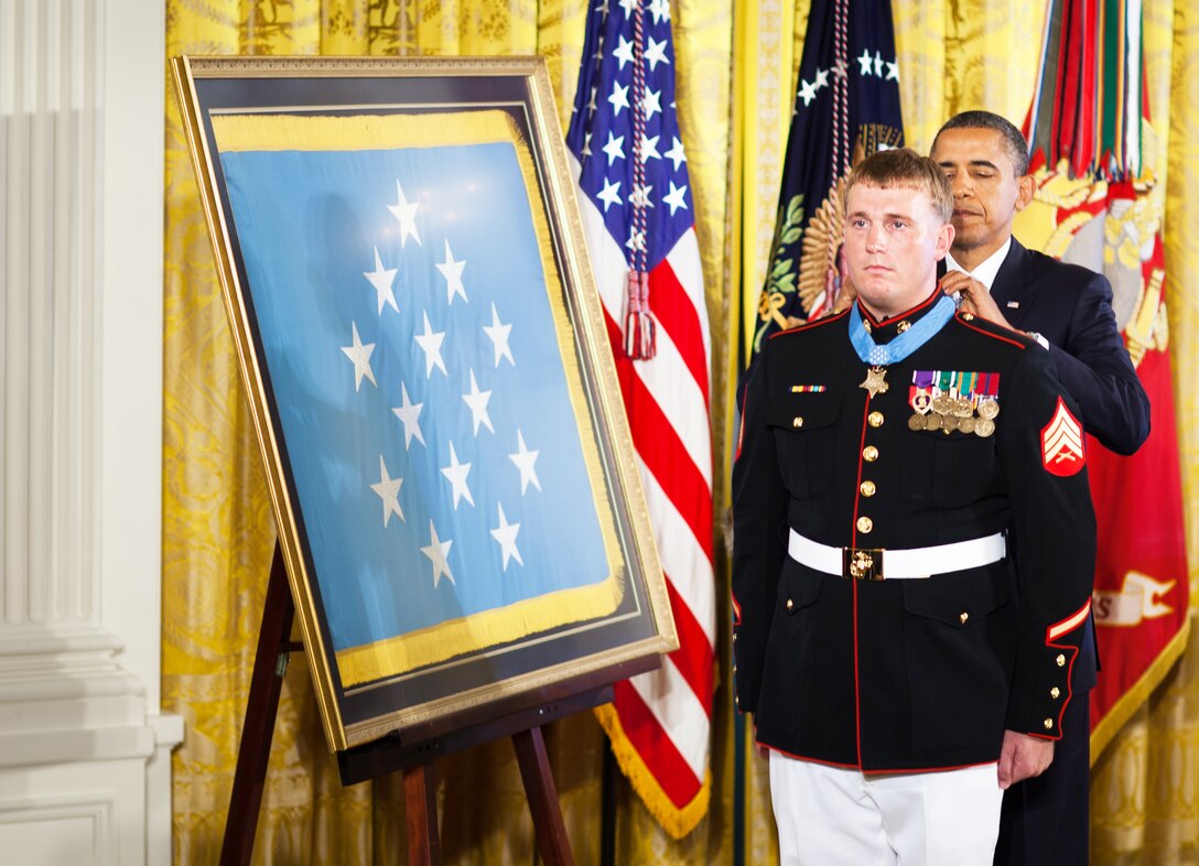 President Barack Obama awards Sgt. Dakota Meyer the Medal of Honor Sept. 15, 2011. Meyer is the first living Marine recipient of the Medal of Honor for actions in Iraq or Afghanistan. He and his family and friends were gathered at the White House to commemorate his selfless service.