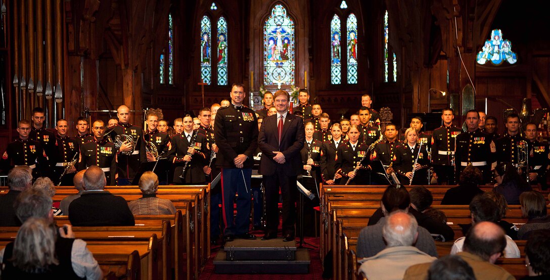 The U.S. Ambassador to New Zealand, David Huebner, stands with the U.S. Marine Corps Forces, Pacific Band at a concert held at Old St. Paul's here Sept. 16 as part of a recently-begun yearlong celebration of the 70th anniversary of Marines landing in Wellington in 1942. Old St. Paul's is a cathedral Marines commonly attended while stationed here in World War II.
