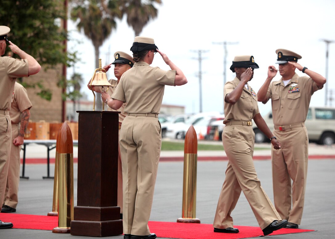 A selectee salutes as she takes her first steps as a chief petty officer during a CPO pinning ceremony at Camp Pendleton, Calif., Sept. 16.