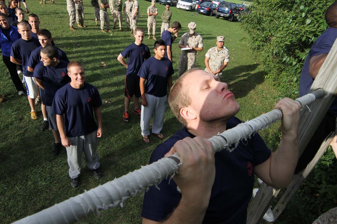 Members of the delayed entry program, or poolees, wait their turn to do pull-ups  during their initial strength test at Recruiting Station Indianapolis Sept. 17. The poolees conducted the IST in order to see how physically ready they are for recruit training.