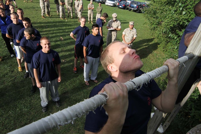 Members of the delayed entry program, or poolees, wait their turn to do pull-ups  during their initial strength test at Recruiting Station Indianapolis Sept. 17. The poolees conducted the IST in order to see how physically ready they are for recruit training.