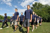 Members of the delayed entry program, or poolees, practice marching in a formation to prepare for recruit training during their initial strength test at Recruiting Station Indianapolis Sept. 17. The poolees conducted the IST in order to see how physically ready they are for recruit training.