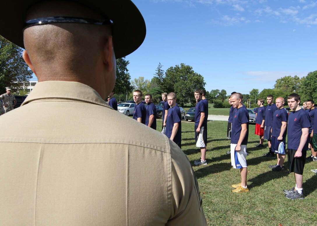 Staff Sgt. Luis C. Cardenas, drill instructor, Company L, 3rd Recruit Training Battalion, Marine Corps Recruit Depot San Diego, teaches members of the delayed entry program how to march at a track across from Recruiting Station Indianapolis headquarters Sept. 17. Members of of the DEP are often referred to as poolees.