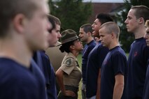 Staff Sgt. Kristy Shaffer, drill instructor, Company P, 4th Recruit Training Battalion, Marine Corps Recruit Depot Parris Island, S.C., has one of the poolees repeat "Aye Aye ma'am"  during an initial strength test at Recruiting Station Indianapolis Sept. 17. "Aye aye" is a term used in boot camp as an acknowledgement and understanding of the order given by a superior officer.