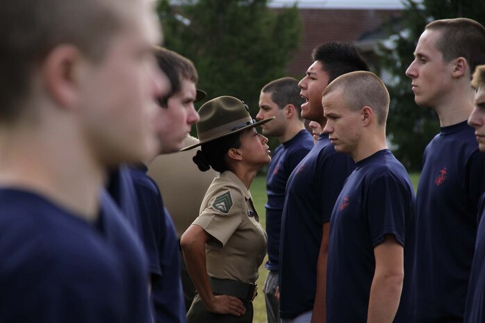 Staff Sgt. Kristy Shaffer, drill instructor, Company P, 4th Recruit Training Battalion, Marine Corps Recruit Depot Parris Island, S.C., has one of the poolees repeat "Aye Aye ma'am"  during an initial strength test at Recruiting Station Indianapolis Sept. 17. "Aye aye" is a term used in boot camp as an acknowledgement and understanding of the order given by a superior officer.