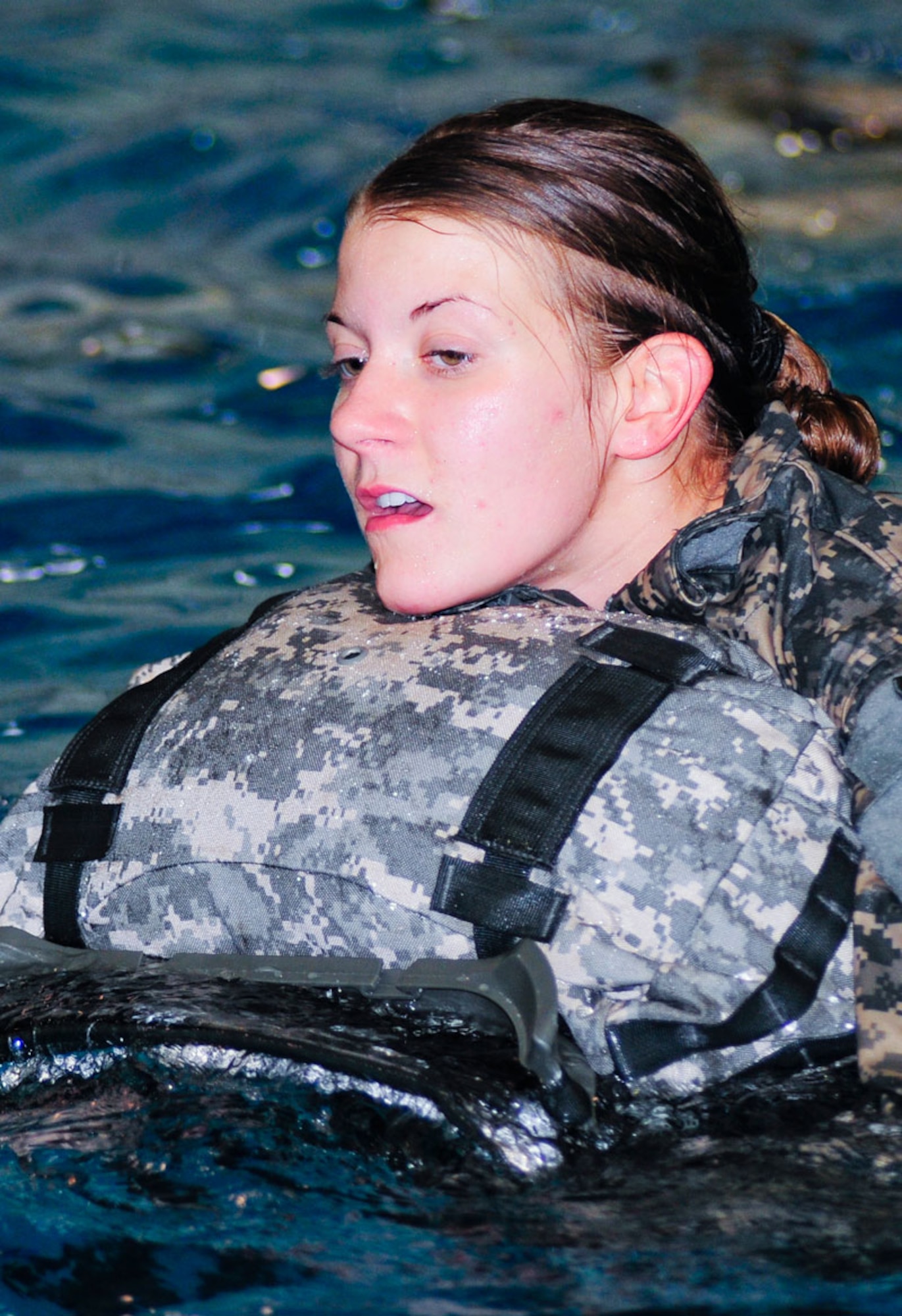 Pvt. Alexandrea Harmon  completes the 25-meter swim with rucksack during combat water survival training, Sept. 1. (U.S. Air Force photo/Percy G. Jones)