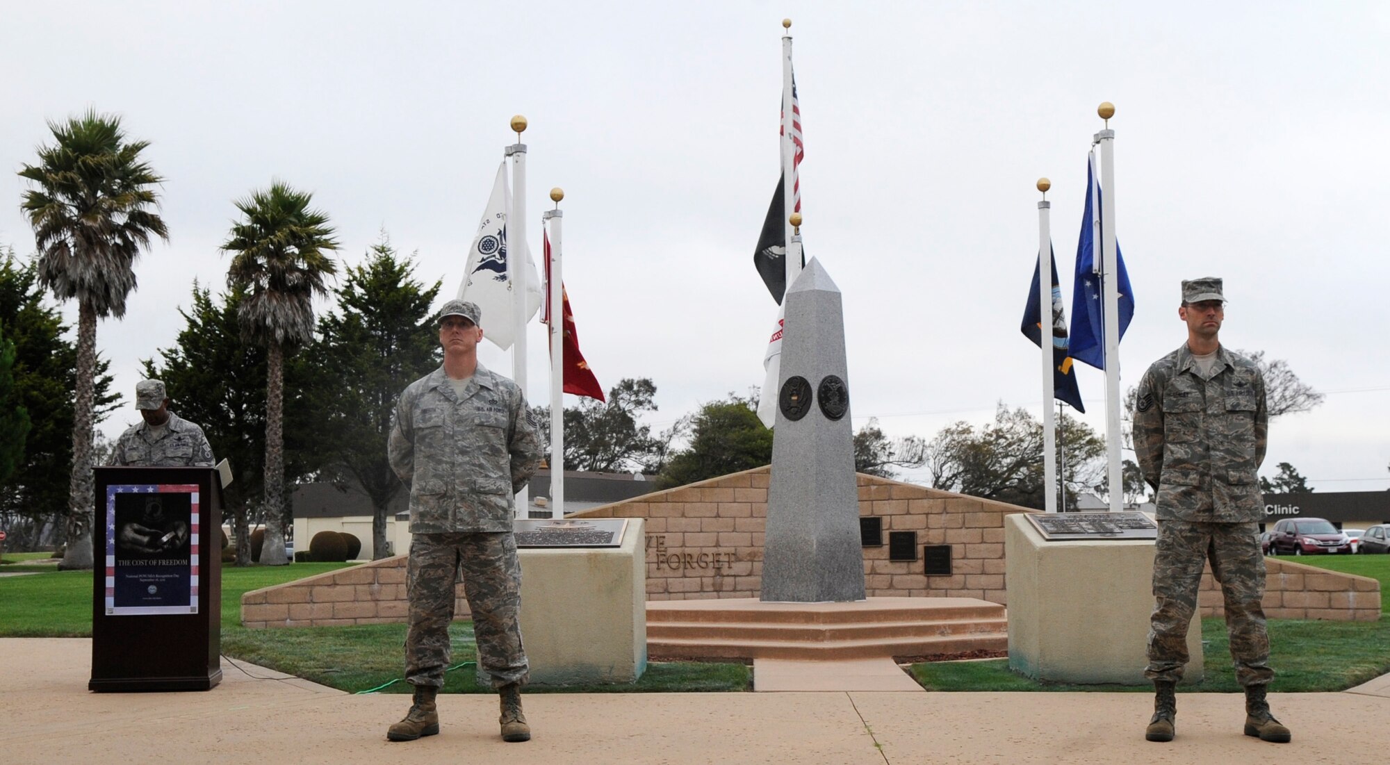 VANDENBERG AIR FORCE BASE, Calif. – Master Sgt. Jay Harris, the 533rd Training Squadron superintendant, reads names as Master Sgt. Dax Griffith, the 30th Civil Engineer Squadron Heavy Repair superintendant, and Tech. Sgt Jeramey Conley, from the 533rd TRS, stand silently in front of the POW/MIA memorial here Thursday, Sept. 15, 2011. The 30th Space Wing held a 24-hour vigil here to read the names of individuals taken as prisoners of war or listed as missing in action. (U.S. Air Force photo/ Staff Sgt. Scottie T. McCord)