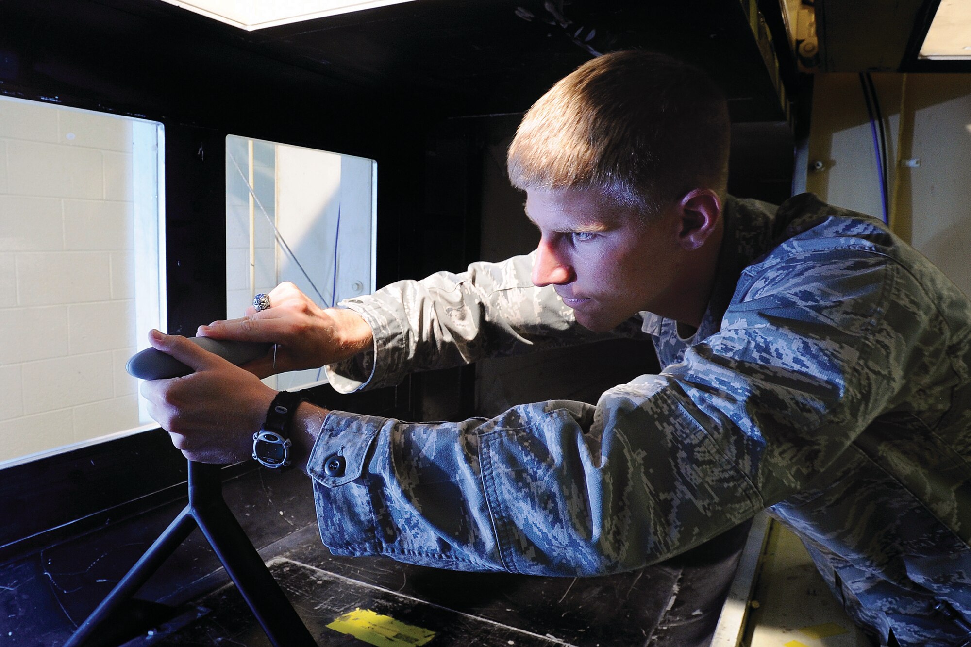 Cadet 1st Class Ryan Kolesar secures a scale model of the Orion Crew Exploration Vehicle to a pylon in an Academy Aeronautics Lab wind tunnel for NASA. The Academy was ranked No. 1 in the nation by high school guidance counselors and second in the nation in aeronautical and astronautical engineering by U.S. News and World Report. (U.S. Air Force Photo/Mike Kaplan)
