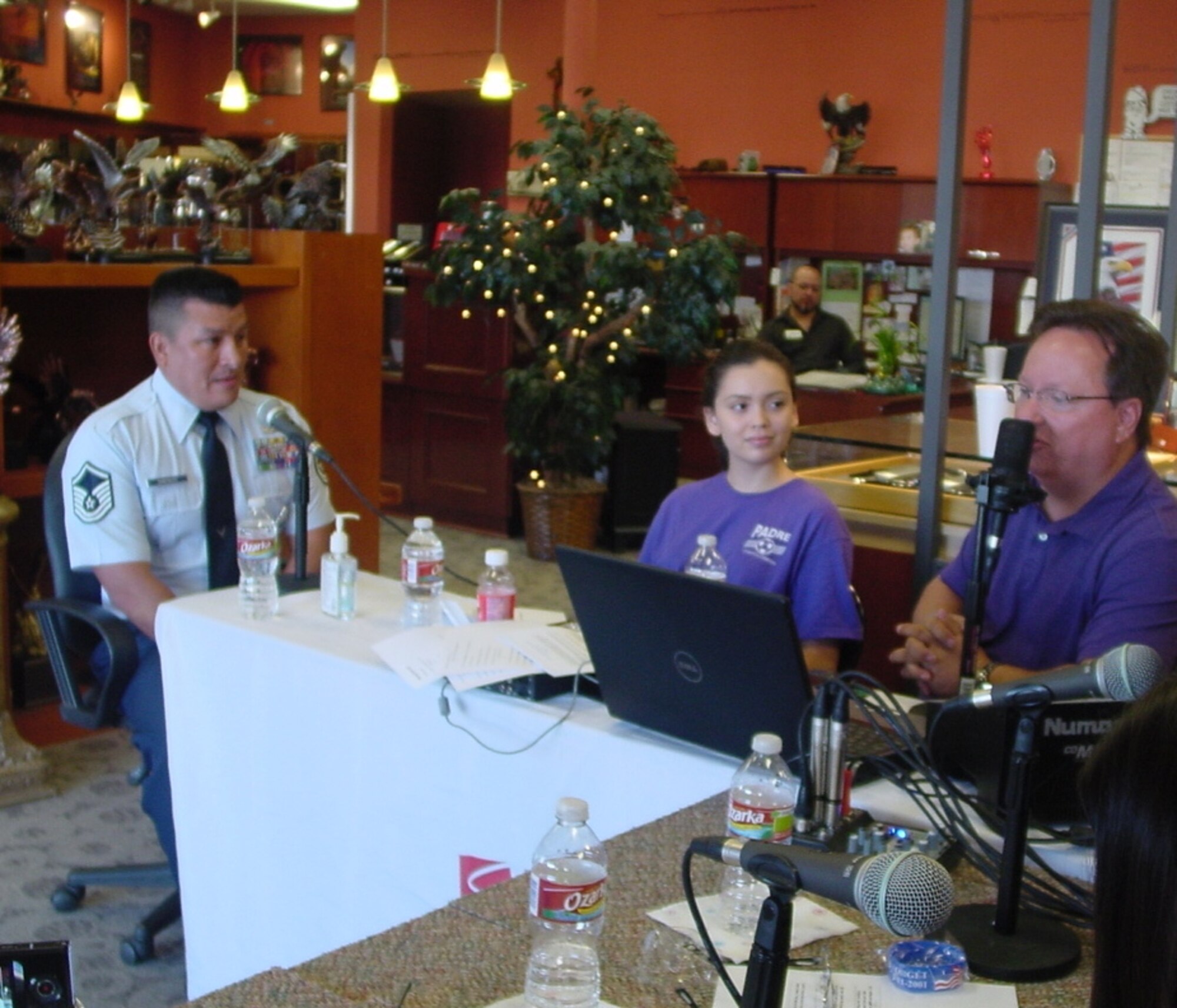 SAN ANTONIO, Texas -- Master Sgt. Edward Gonzales (left), 341st Recruiting Squadron flight chief, was interviewed by DJ Jay Tope (right) for the “The Jay Tope Show” broadcast live from Successories Sept. 9. Gonzales answered questions concerning the current state of recruiting as well as the many career and educational opportunities available in the Air Force. Domonique Ramirez (center), Ms. San Antonio 2011, was also in attendance during the broadcast. The broadcast aired on www.radiosanantonio.com. (U.S. Air Force photo/Tammany Williams)


