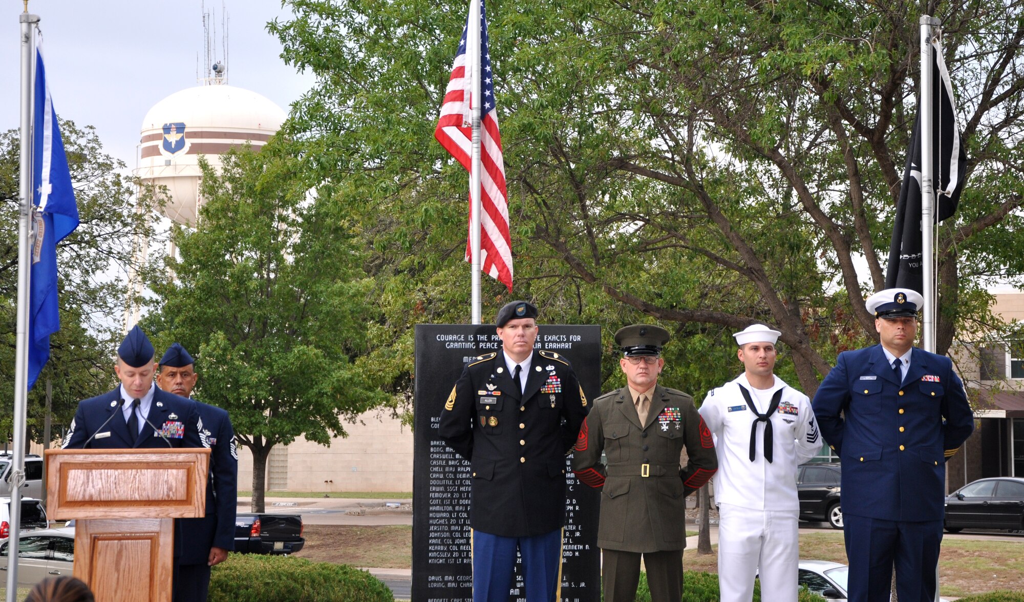 GOODFELLOW AIR FORCE BASE, Texas -- Chief Master Sgt. Brendan Criswell (left), 17th Training Wing Command Chief, starts off the reading of POW/MIA names during the 17th Training Wing POW/MIA Recognition Day Vigil at the Medal of Honor/POW/MIA Memorial here . (U.S. Air Force photo/Connie Hempel)