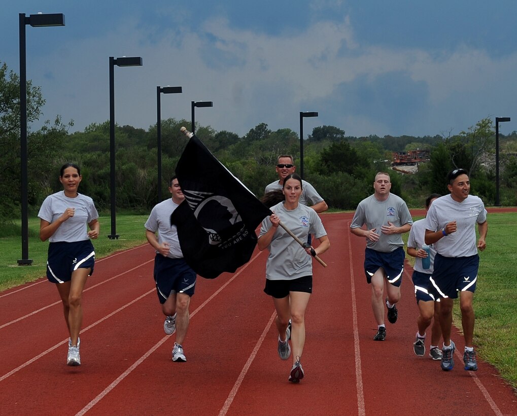 First Sergeants complete their portion of the POW/MIA 24-hour Run/Walk Vigil at Langley Air Force Base, Va., Sept. 16, 2011. The vigil is an annual event that allows volunteers to honors those who have came before them.  (U.S.  Air Force photo by Staff. Sgt. Antoinette Gibson/Released)
