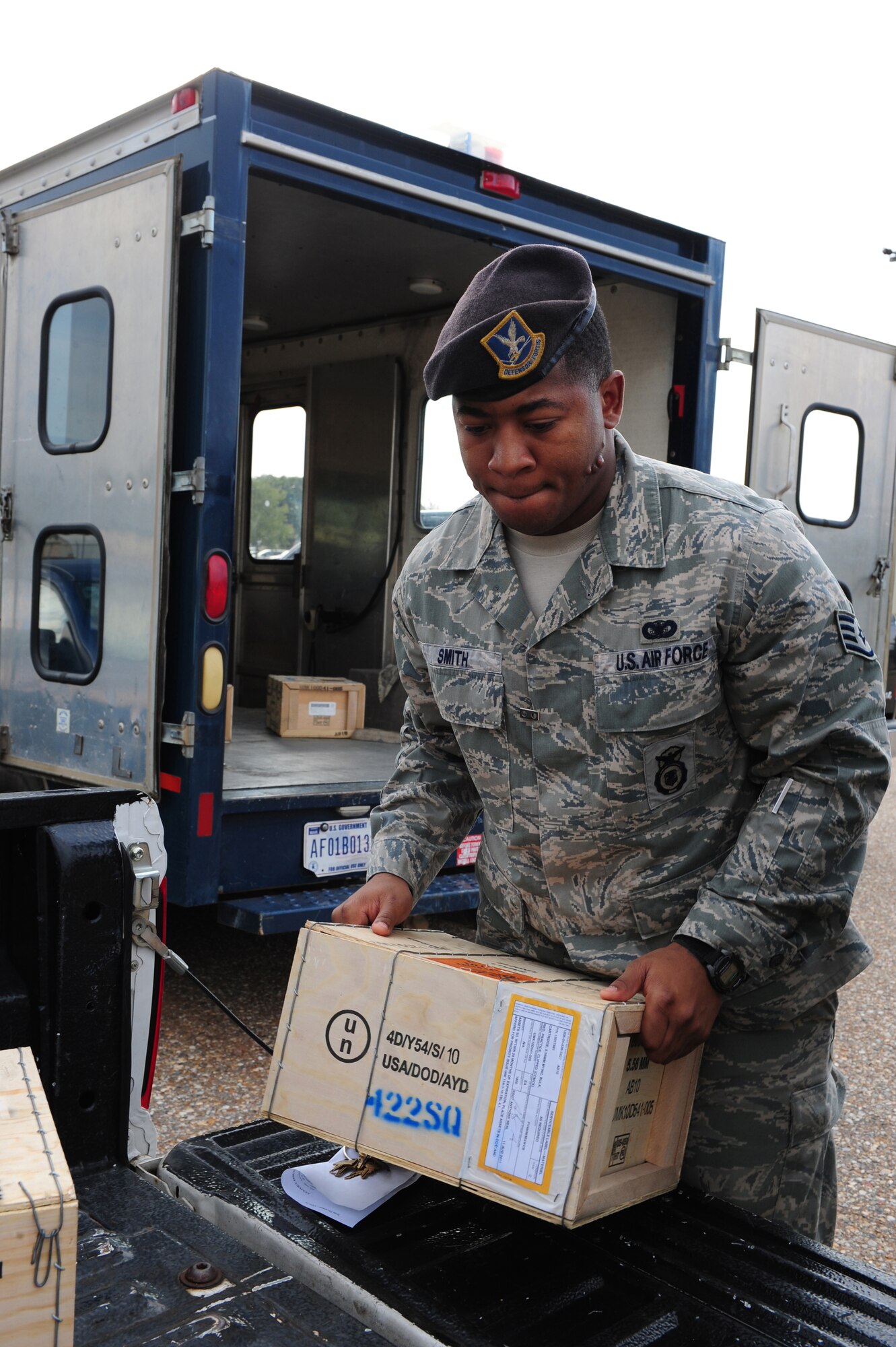 Staff Sgt. Sherman Smith, 2nd Security Forces Squadron, transfers ammunition from one equipment truck to another on Barksdale Air Force Base, La., Sept. 15. The 2 SFS is preparing to move to a new building with a more spacious armory. (U.S. Air Force photo/Airman 1st Class Benjamin Gonsier)(RELEASED)