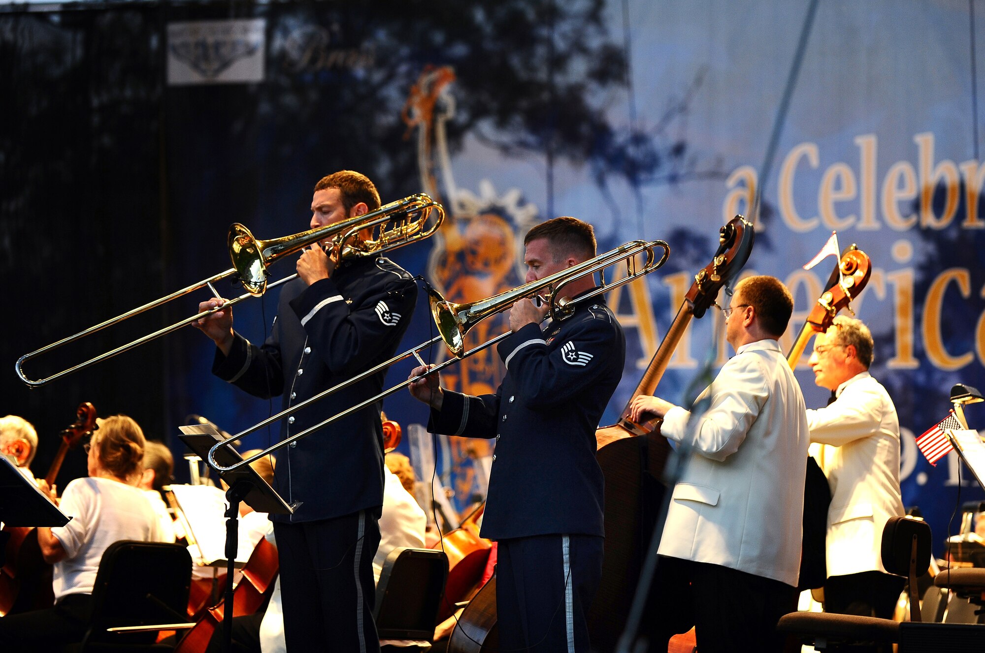 Trombone players with the U.S. Air Force Heartland of America Band's Brass in Blue ensemble perform with the Omaha Symphony at a 9/11 10-year anniversary concert held at Turner Park in Omaha, Neb., Sept. 11.  A crowd of more than 9,000 were treated to a free hour and a half concert by the combined group. (U.S. Air Force photo by Josh Plueger/Released)