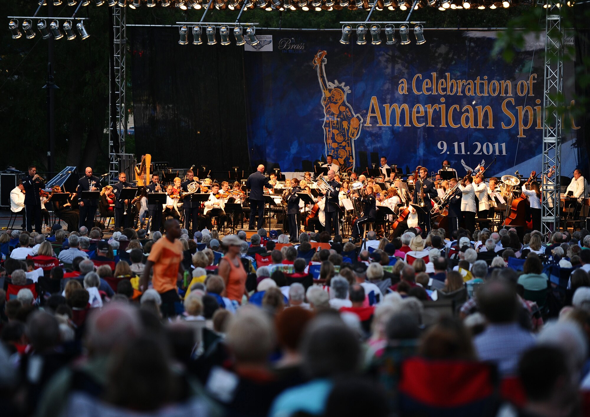 A crowd of more than 9,000 people were in attendance to witness the U.S. Air Force Heartland of America Band's Brass in Blue ensemble performs with the Omaha Symphony at a 9/11 memorial concert held at Turner Park in Omaha, Neb., Sept. 11.  The performance included tributes to the city of New York, as well as the men and women of the armed forces. (U.S. Air Force photo by Josh Plueger/Released) 