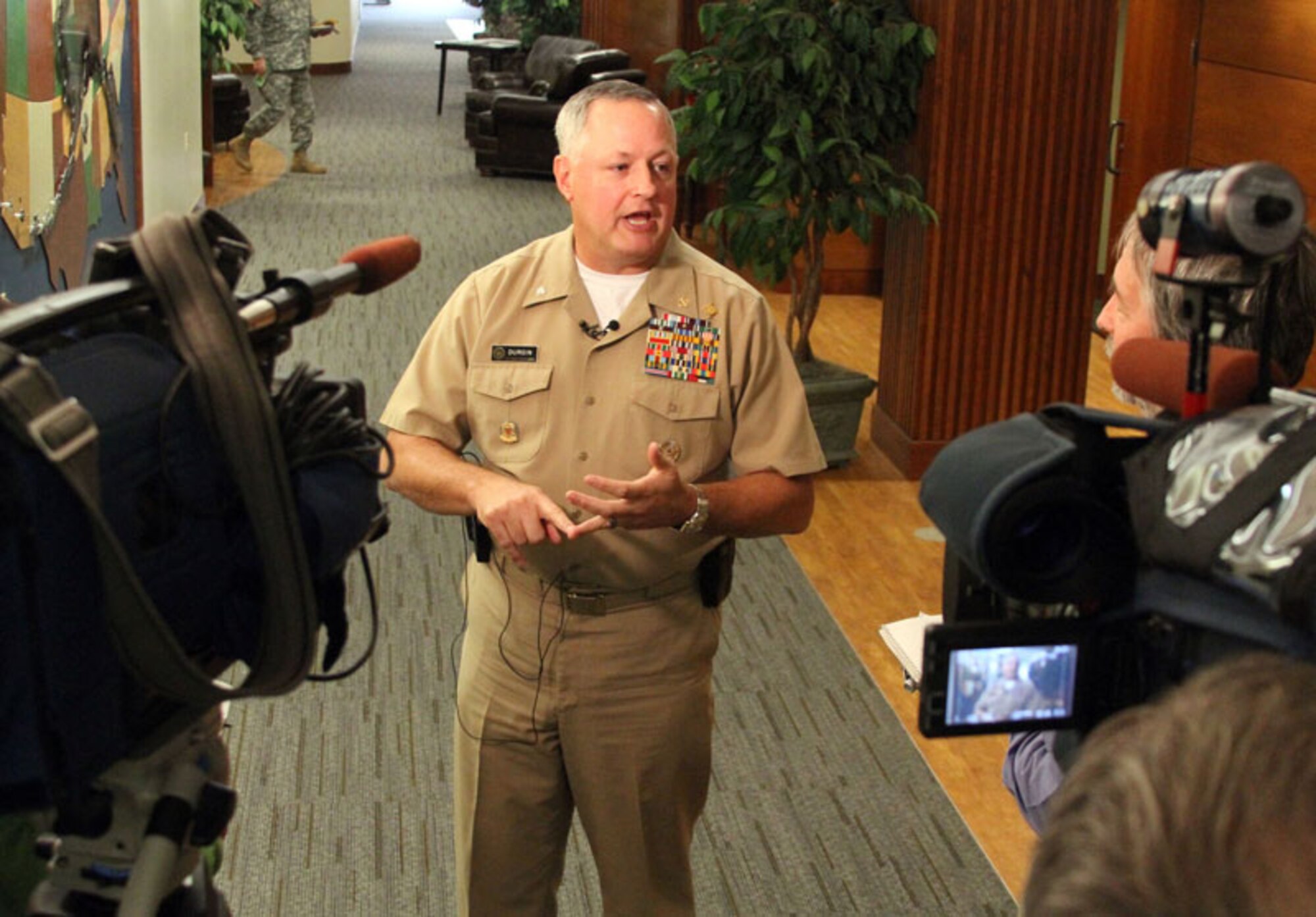 U.S. Public Health Service Cmdr. George Durgin, chief of the Resilience Division at the Defense Centers of Excellence for Psychological Health and Traumatic Brain Injury, talks to Anchorage reporters during a USARAK senior leader conference at Joint Base Elmendorf-Richardson, Sept. 7. The event brought commanders and staff together to focus on promoting resilience in USARAK Soldiers and families. (U.S. Army photo/Staff Sgt. Jason Epperson)
