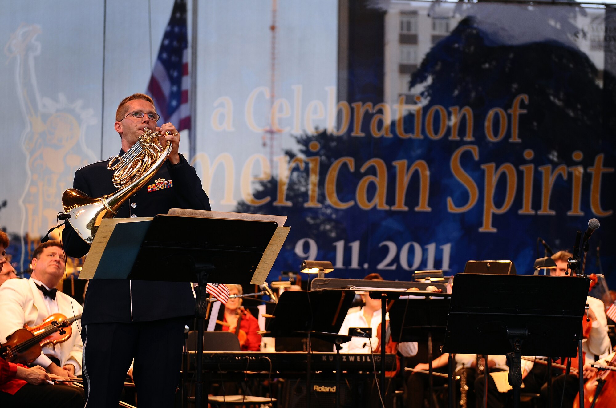 U.S. Air Force Tech. Sgt. Ryan Heseltine, a French horn player with the Brass in Blue ensemble of the U.S. Air Force Heartland of America Band, performs at the 9/11 memorial concert, A Celebration of the American Spirit, held at Turner Park in Omaha, Neb., Sept. 11.  More than 9,000 people were in attendance to watch the ensemble play with the Omaha Symphony. (U.S. Air Force photo by Josh Plueger/Released)