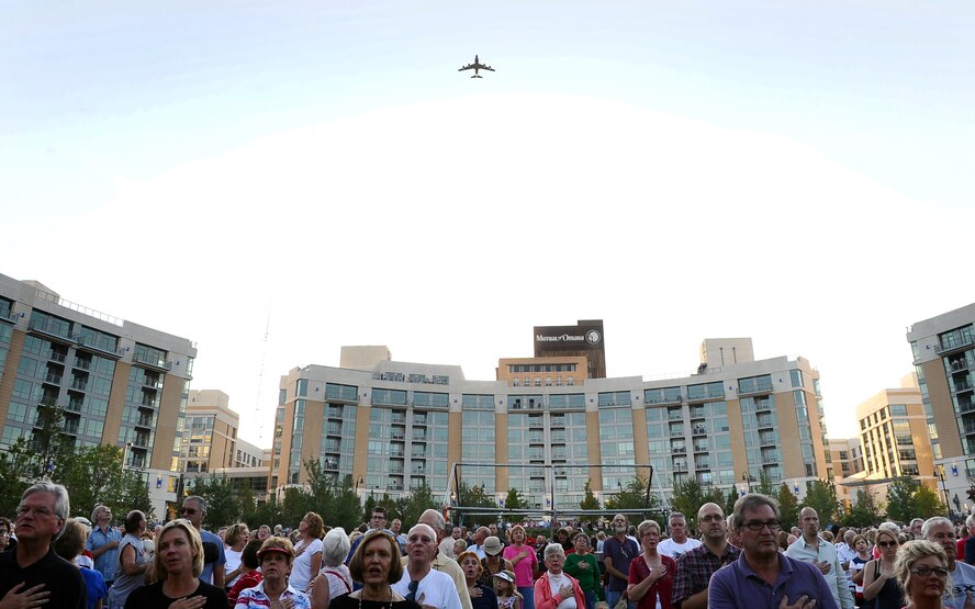 An RC-135V/W Rivet Joint aircraft performs a flyover to start the A Celebration of American Spirit memorial concert held at Turner Park in Omaha, Neb., Sept. 11.  The U.S. Air Force's Heartland of America Band and the Omaha Symphony joined forces to provide a memorial concert on the 10-year anniversary of 9/11 to a crowd of more than 9,000 people. (U.S. Air Force photo by Josh Plueger/Released)