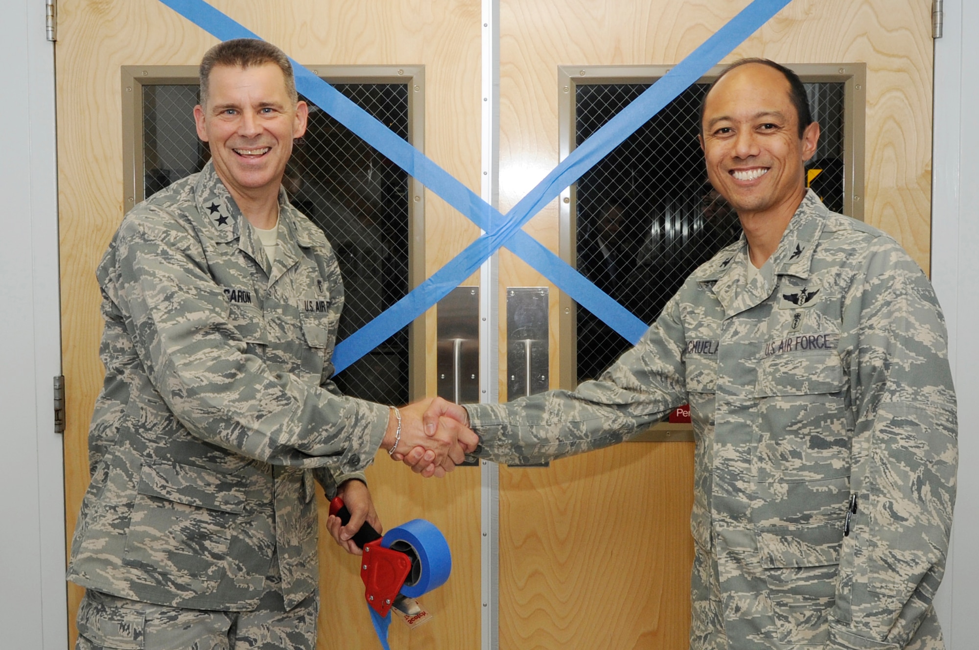 Maj. Gen Gerald Caron, Commander of the 79th Medical Wing, and Col. Rudolph Cachuela, Commander of the 779th Medical Group, Joint Base Andrews Md., seal the doors to the Malcolm Grow Medical Center’s Intensive Care Unit for the last time during a ceremony renaming Malcolm Grow Medical Center to Malcolm Grow Medical Clinic. (U.S. Air Force photo by Staff Sgt. Raymond Mills) 