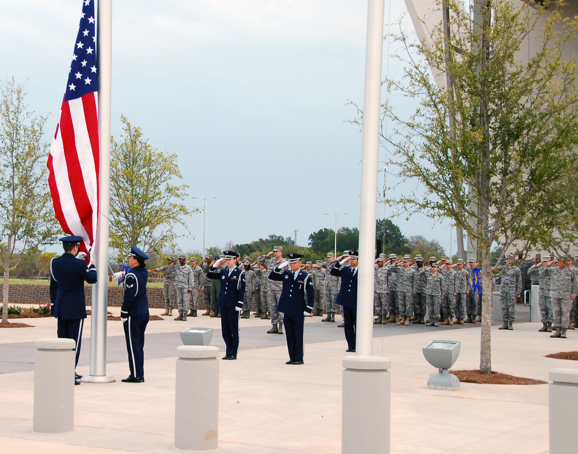BOSSIER CITY, La. - Members of the Eighth Air Force Headquarters, 608th Air and Space Operations Center and 608th Air Communications Squadron salute the U.S. flag during a reveille ceremony at the Cyber Innovation Center in celebration of the Air Force’s 64th birthday Sept. 16. Sixty-four years ago, President Harry Truman signed the National Security Act of 1947, establishing the United States Air Force as a separate military service. Since Sept. 18, 1947, the U.S. Air Force – through its Airmen and technology – has played a key role in the defense of the U.S., maintenance of peace and humanitarian operations around the world. (U.S. Air Force photo by Staff Sgt. Brian Stives)
