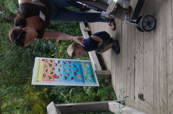 Using the butterfly chart, Ingrid Bender, right, and her son Max Bender, identify a species of butterfly Sept. 13 at the ABQ BioPark Botanic Garden.

Photo by Jonathan Rejent